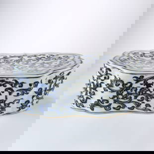 A BLUE AND WHITE PILLOW WITH SCROLL DESIGN: Blue and White Pillow with Scroll Design