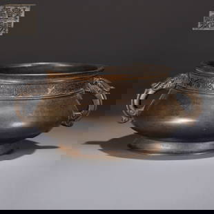 A BRONZE INCENSE BURNER WITH DOUBLE BEAST-SHAPED HANDLES: Bronze Incense Burner with Double Beast-Shaped Handles