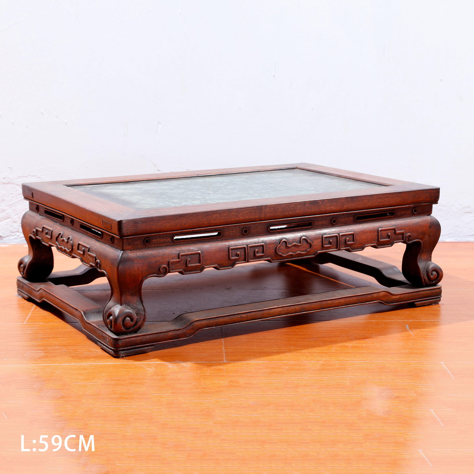 A HUANGHUALI WOOD CARVED TEA TABLE: Huanghuali Wood Carved Tea Table