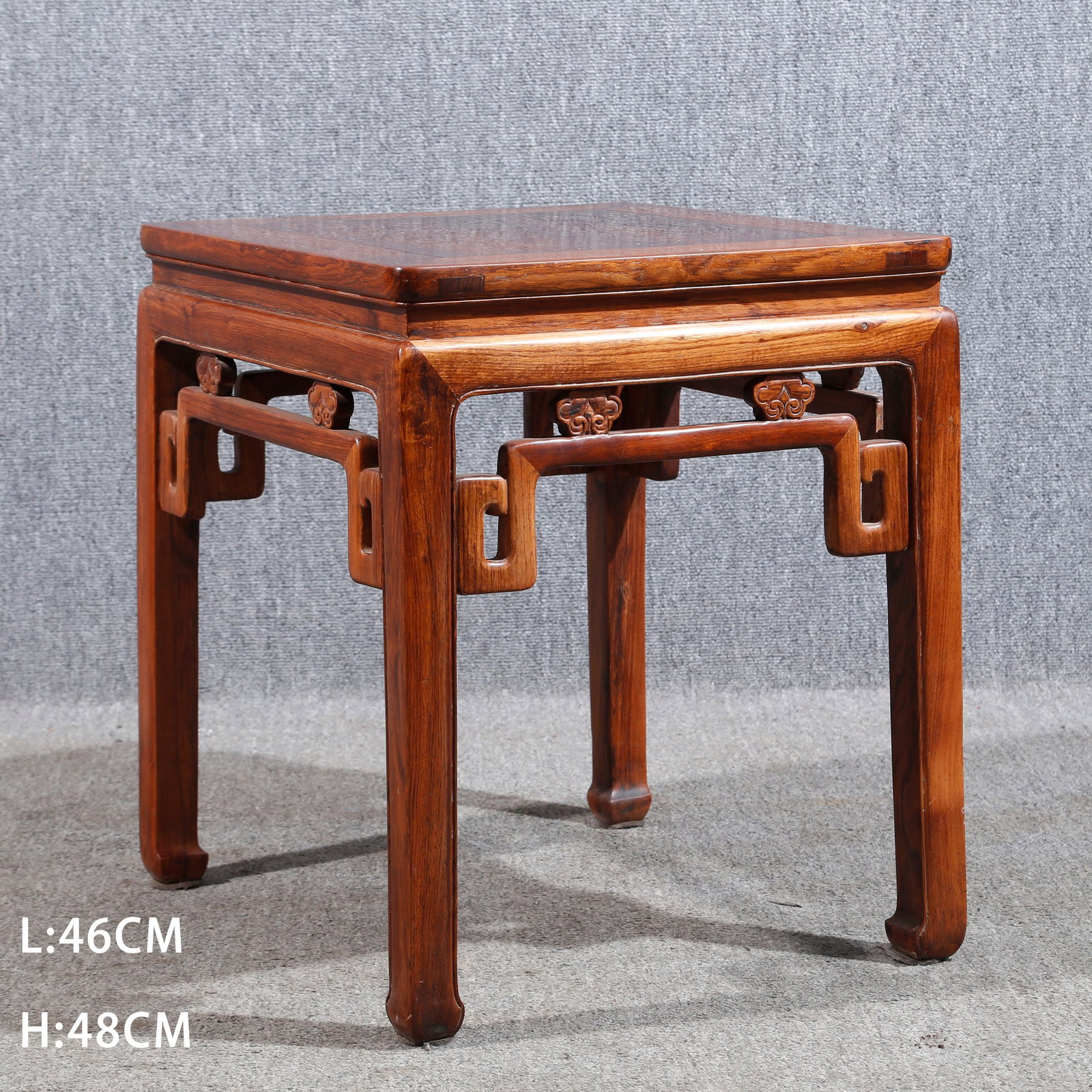 A HUANGHUALI WOOD CARVED TEA TABLE: Huanghuali Wood Carved Tea Table