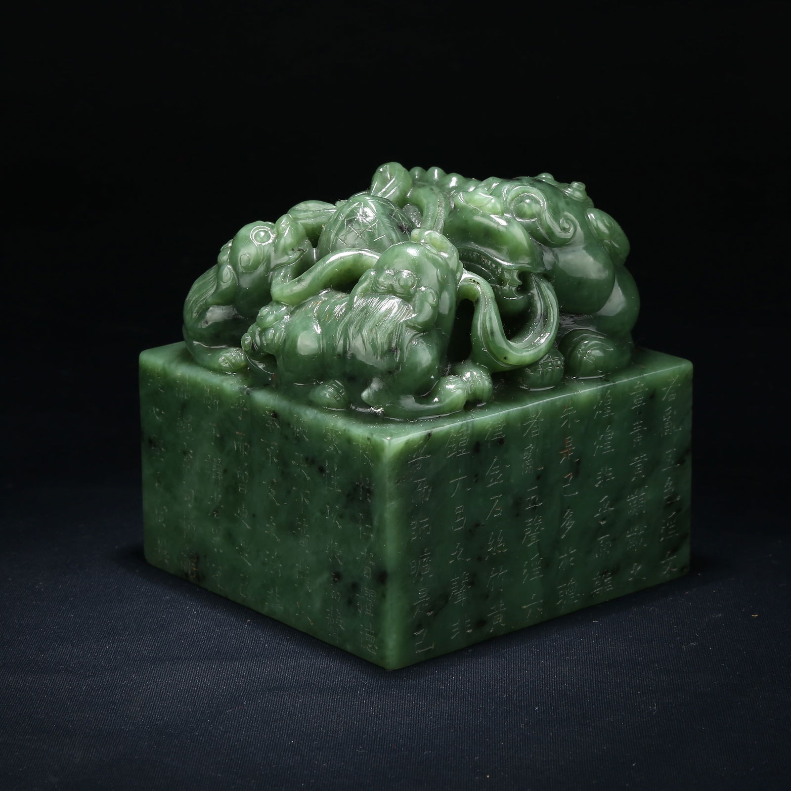 A HETIAN JASPER SEAL WITH LARGE AND SMALL LION KNOBS (1 of 9)