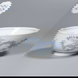 A BLUE AND WHITE BOWL WITH CLOUD AND DRAGON DESIGN: Blue and White Bowl with Cloud and Dragon Design