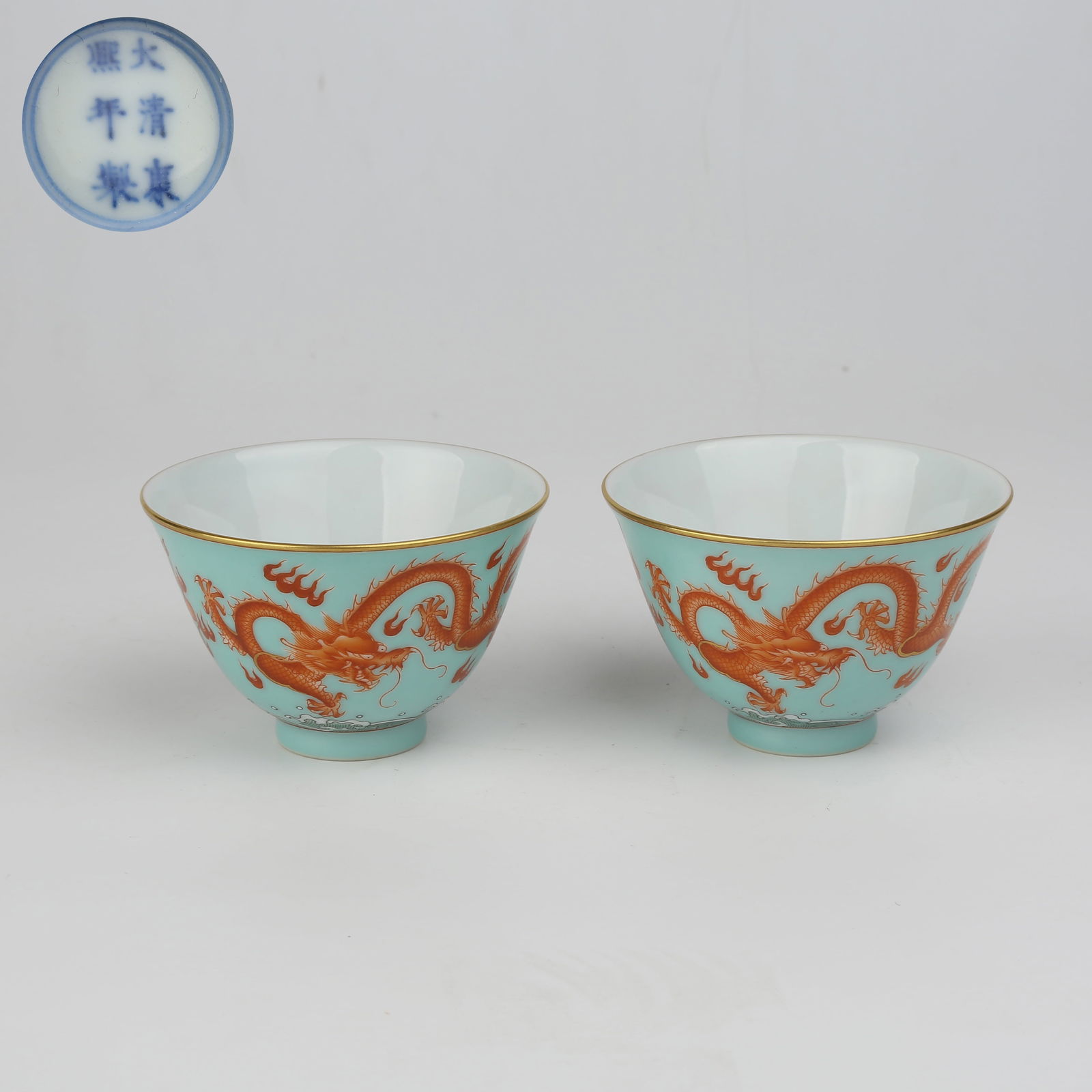 A SET OF TURQUOISE GROUND FAMILLE-ROSE CUPS WITH DRAGON CHASING PEARL DESIGN: Set of Turquoise Ground Famille-Rose Cups with Dragon Chasing Pearl Design