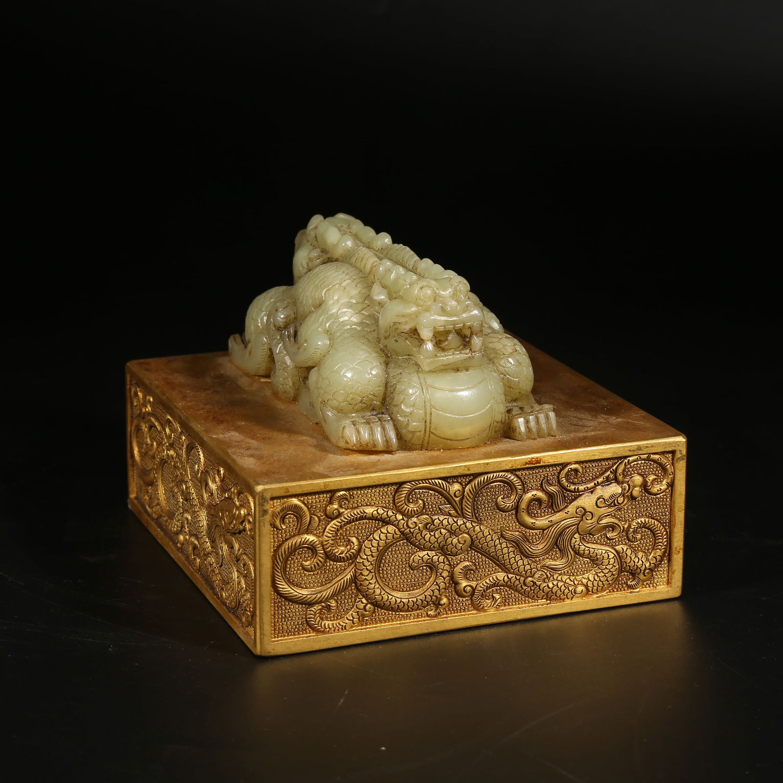 A GILT BRONZE SEAL WITH INTERTWINED DRAGON KNOB INLAID WITH HETIAN JADE (1 of 8)