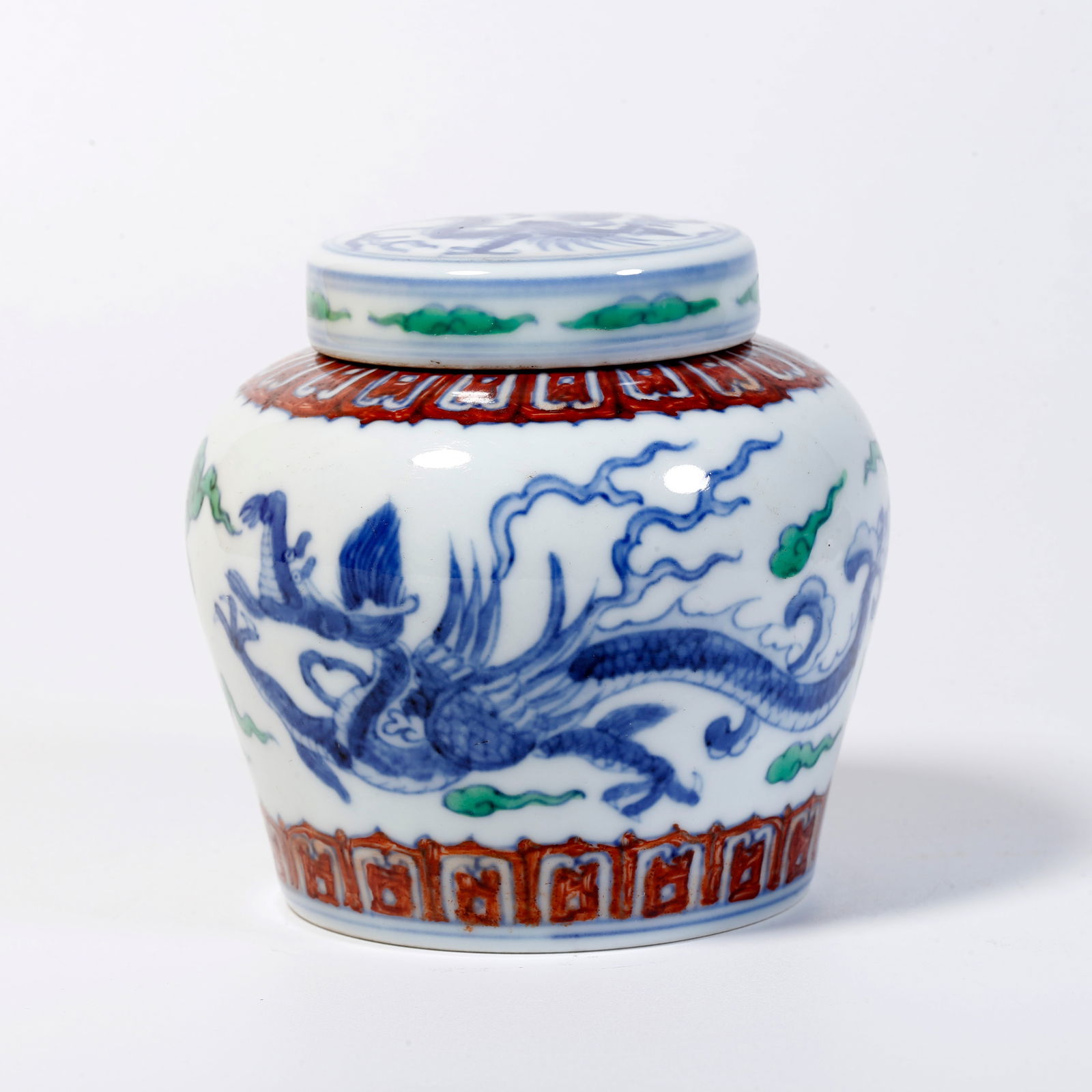 A BLUE AND WHITE LIDDED JAR WITH CLOUD-AND-DRAGON DESIGN: Blue and white lidded jar with cloud-and-dragon design