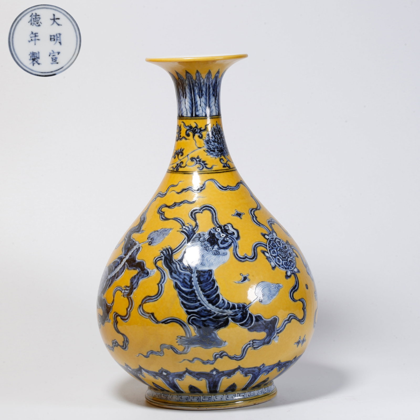 A BLUE AND WHITE LION PLAYING WITH EMBROIDERED BALL PATTERNED JADE HU SPRING BOTTLE: Blue and white lion playing with embroidered ball patterned jade hu spring bottle