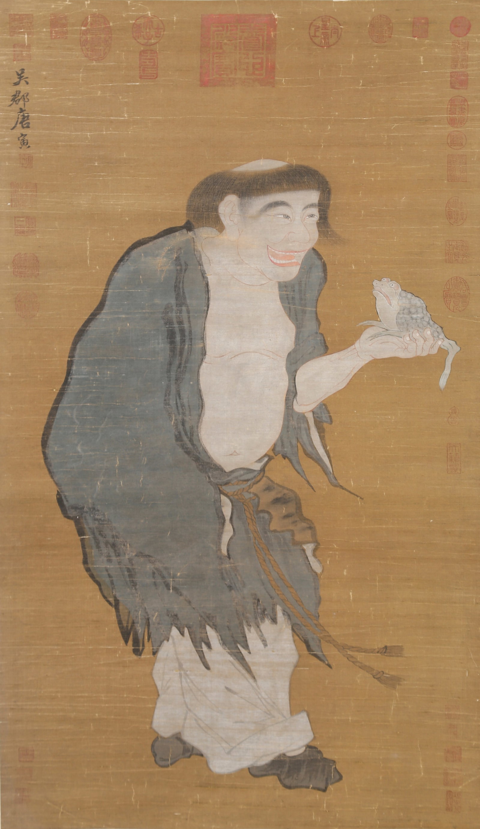 A "LIU HAI PLAYING WITH THE GOLDEN TOAD" PAINTING ON SILK BY TANG BOHU.唐伯虎: "Liu Hai Playing with the Golden Toad" Painting on Silk by Tang Bohu.唐伯虎