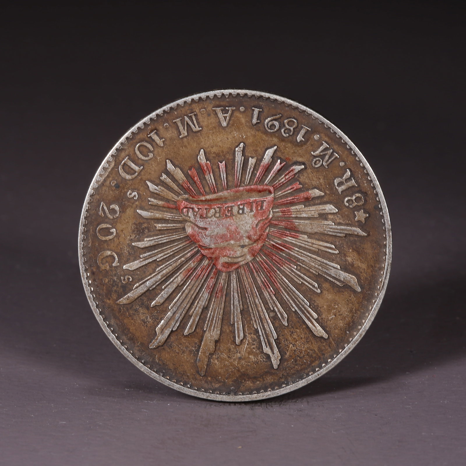 A SILVER DOLLAR COIN: One Silver dollar Coin