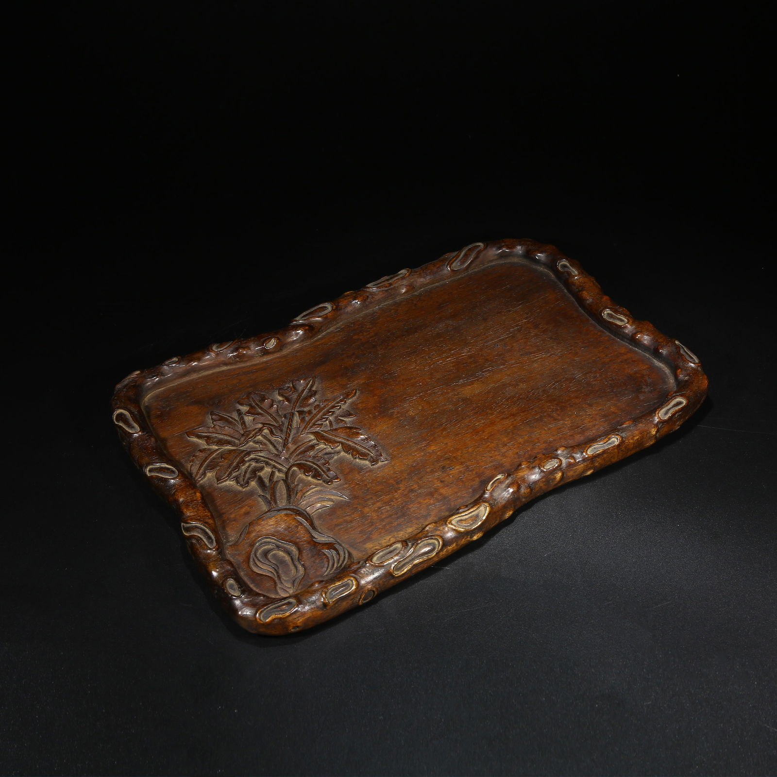 A HUANGHUALI WOOD PATTERNED TRAY: Huanghuali wood patterned tray