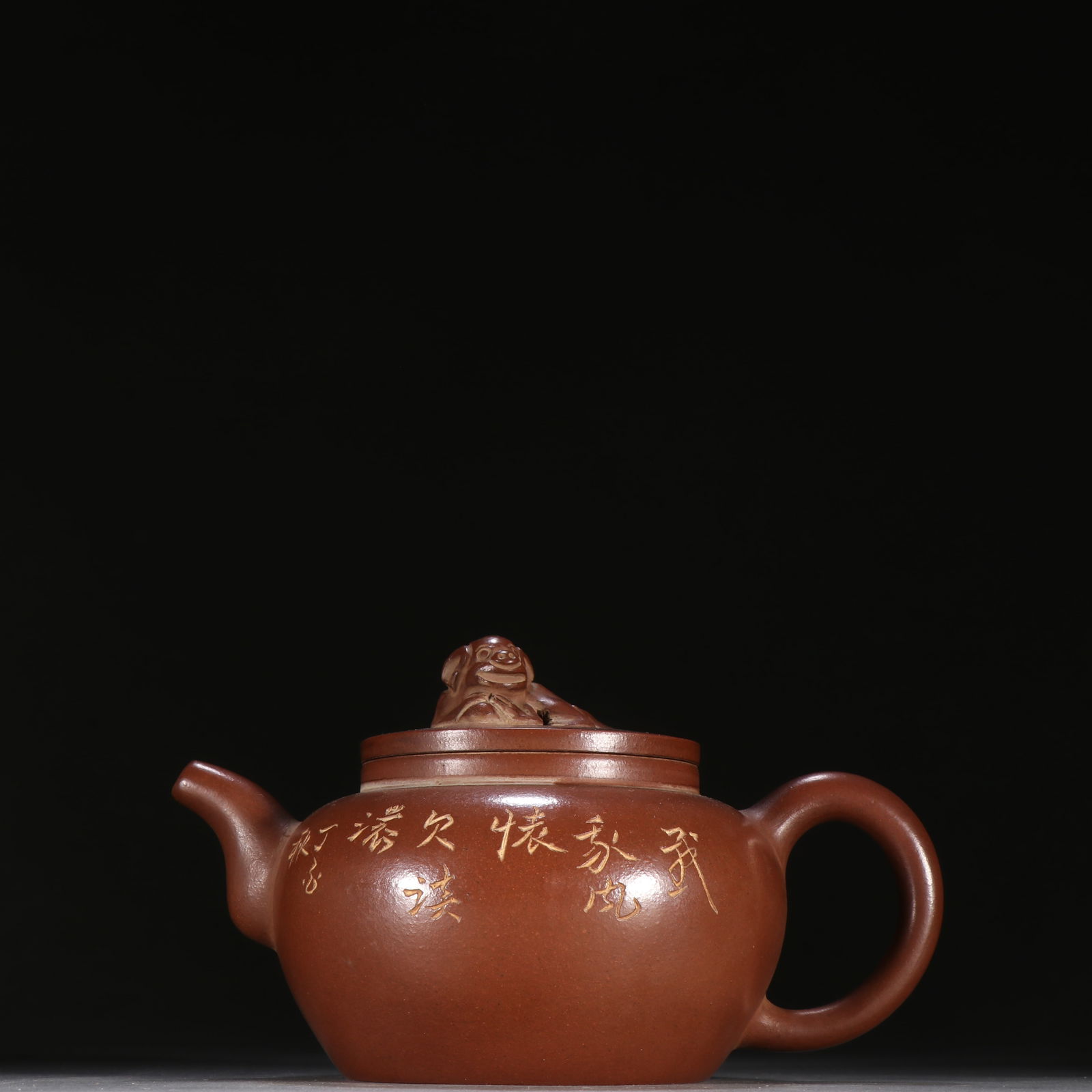 A MASTER-CRAFTED YIXING ZISHA TEAPOT CARVED WITH POETRY (1 of 9)