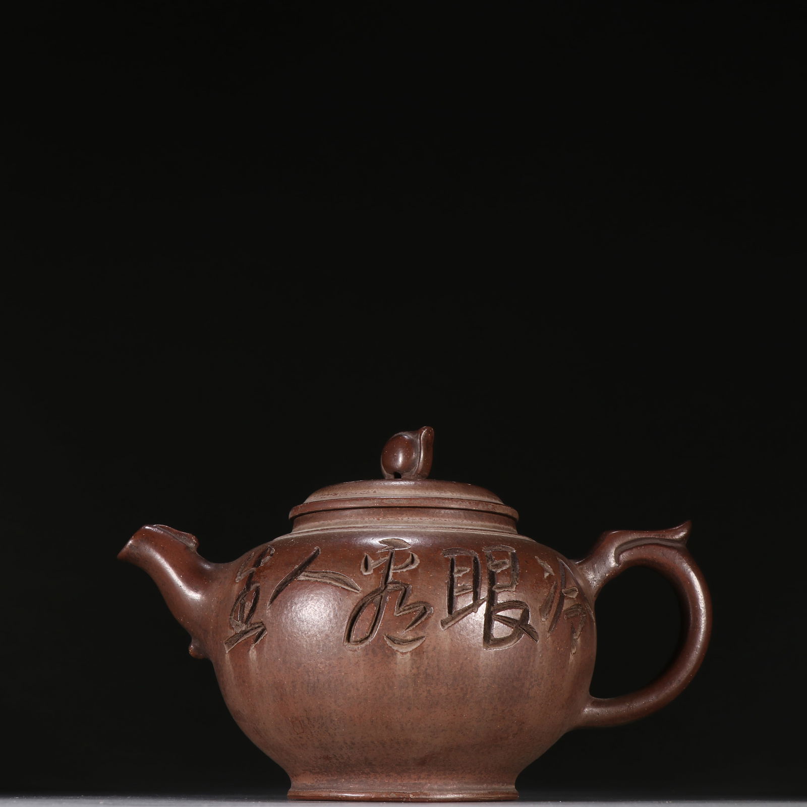 A YIXING ZISHA TEAPOT CARVED WITH POETRY (1 of 9)