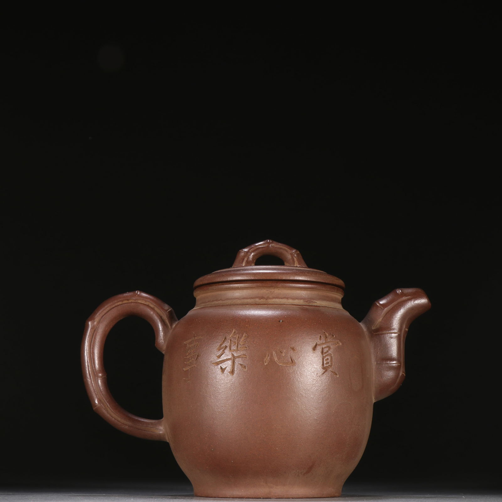 A MASTER-CRAFTED YIXING ZISHA BAMBOO-JOINT PATTERNED TEAPOT (1 of 9)