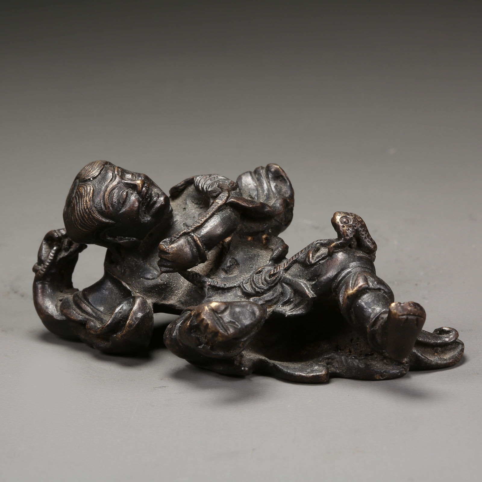 A BRONZE LIU HAI PLAYING WITH GOLDEN TOAD PAPERWEIGHT: Bronze Liu Hai Playing with Golden Toad Paperweight