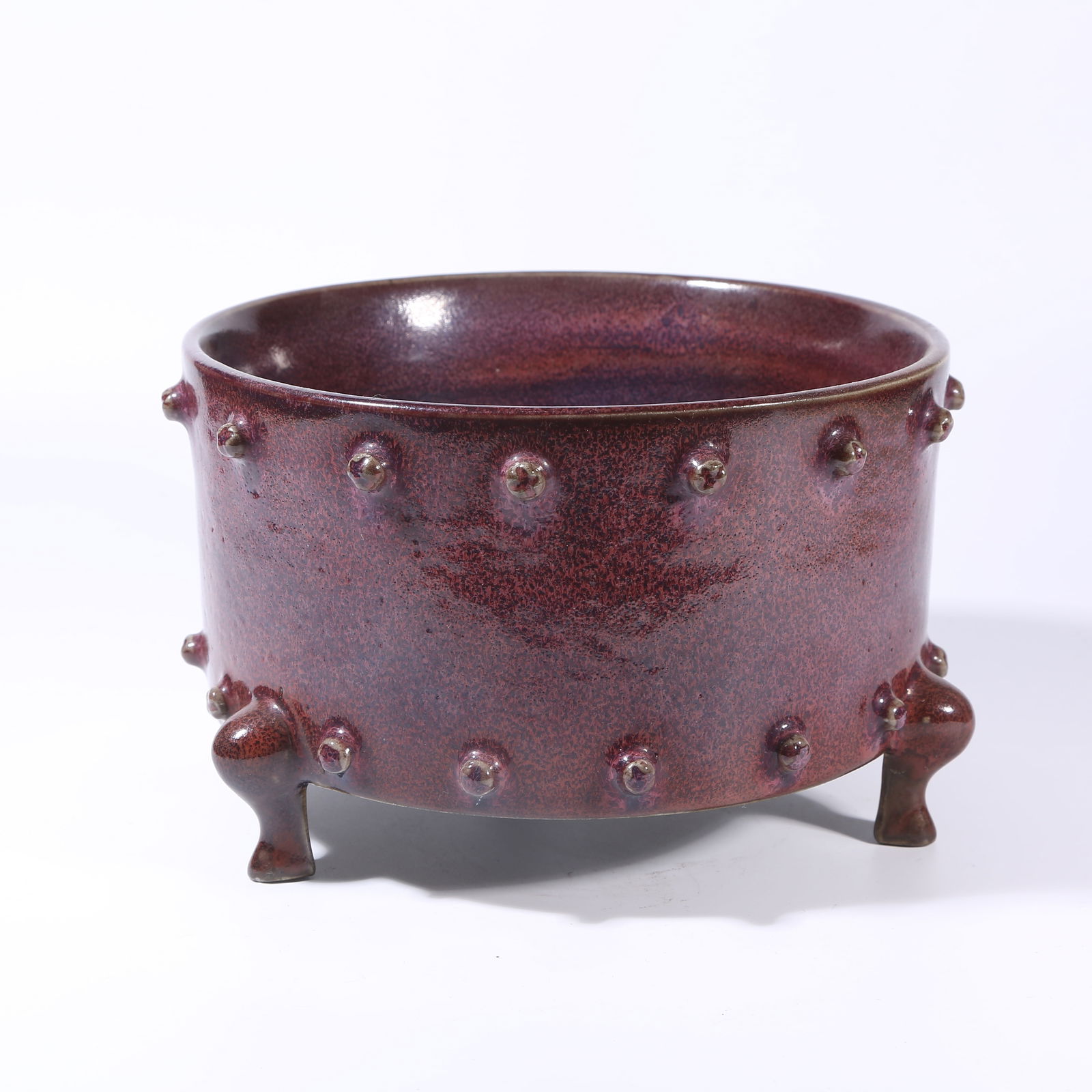 A JUN KILN TRIPOD STUDDED DRUM-SHAPED CENSER: Jun kiln tripod studded drum-shaped censer