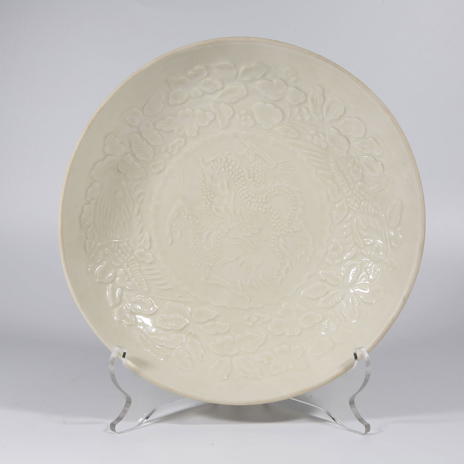 A DING KILN MOLDED DRAGON PATTERN PLATE: Ding Kiln Molded Dragon Pattern Plate