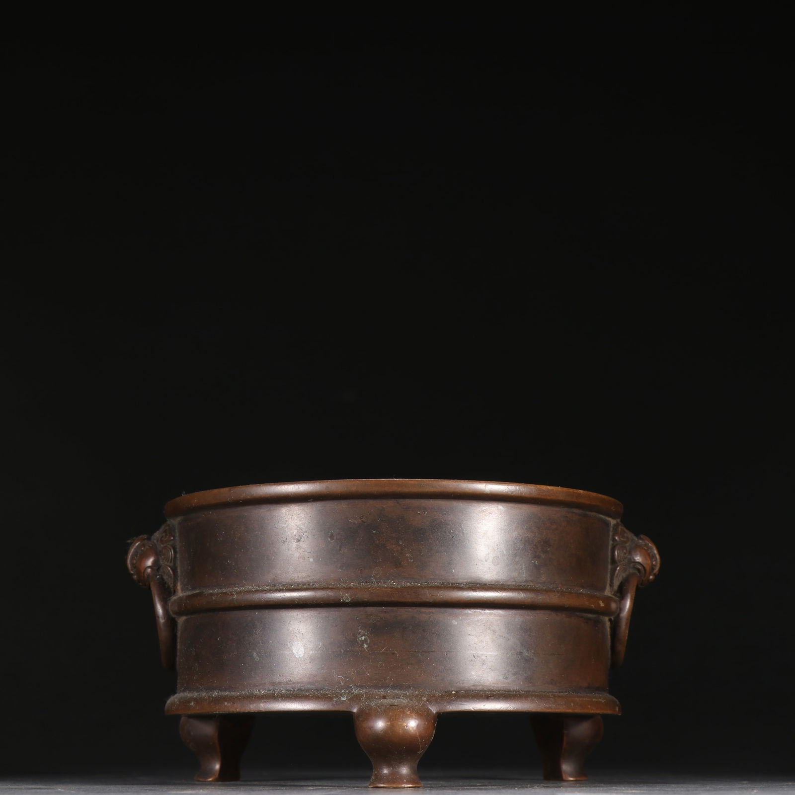 A BRONZE-BODY DRUM-SHAPED INCENSE BURNER WITH BEAST-HEAD RING HANDLES: Bronze-Body Drum-Shaped Incense Burner with Beast-Head Ring Handles