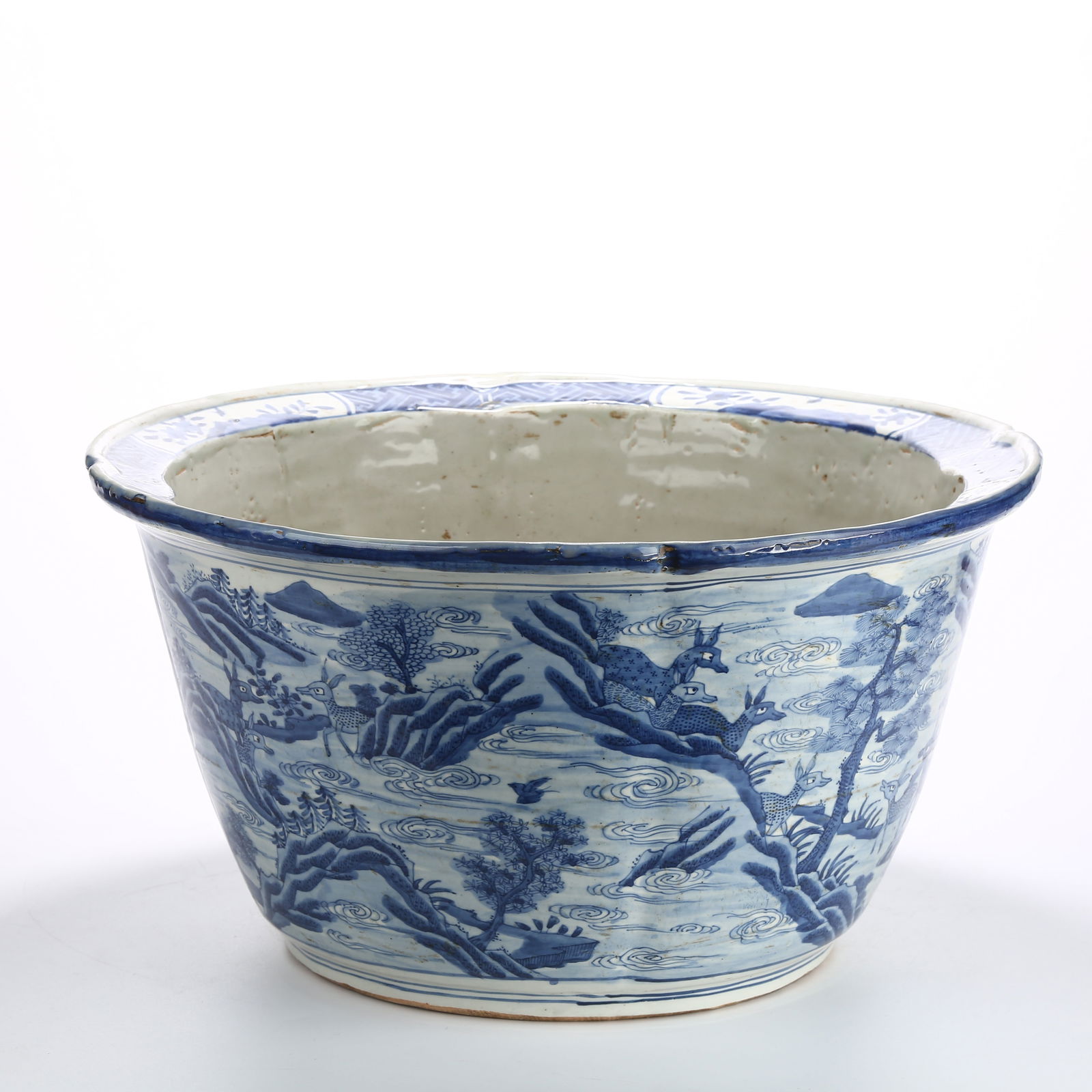 A BLUE AND WHITE LARGE FLOWERPOT WITH HUNDRED DEER DESIGN AND LOBED RIM: Blue and White Large Flowerpot with Hundred Deer Design and Lobed Rim