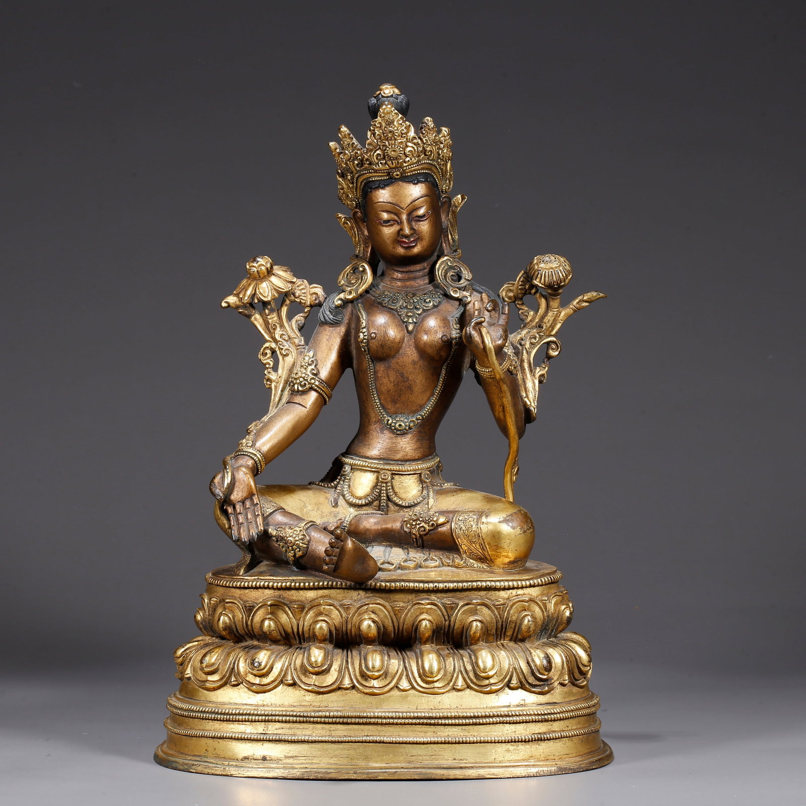 A GILT BRONZE STATUE OF GREEN TARA: Gilt Bronze Statue of Green Tara