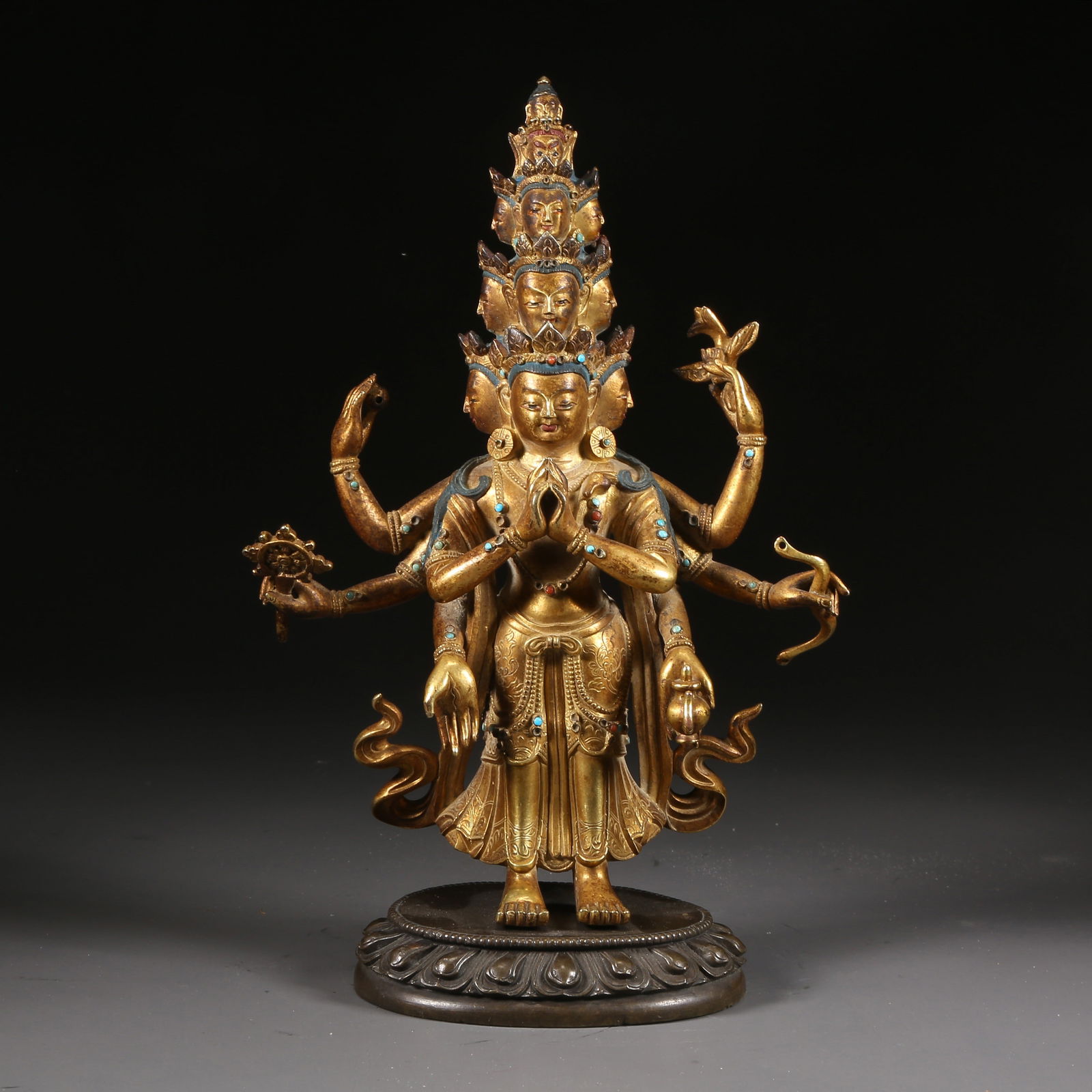 A GILT-BRONZE STATUE OF THE ELEVEN-HEADED AVALOKITE?VARA: Gilt-bronze statue of the Eleven-headed Avalokite?vara