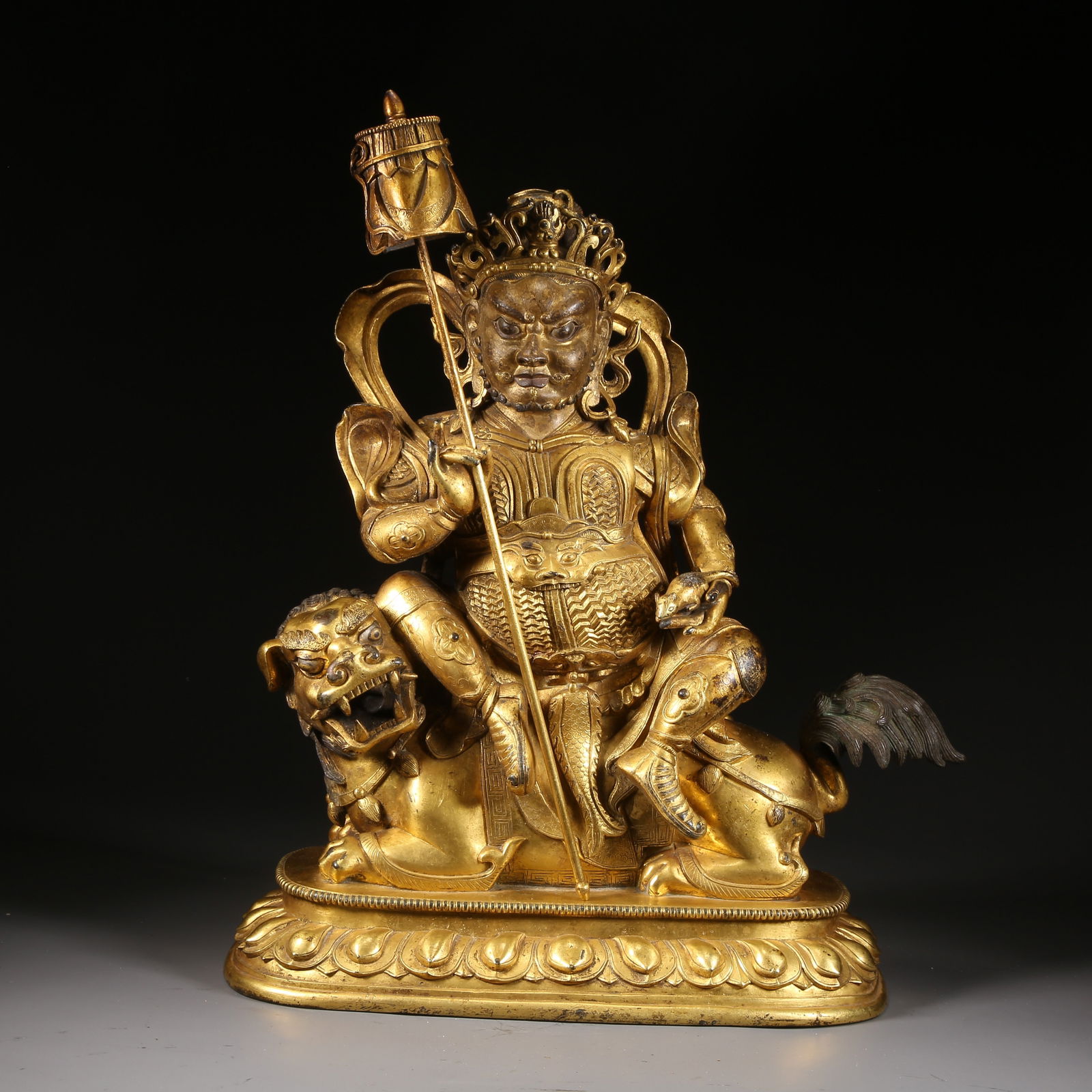 A GILT-BRONZE STATUE OF VAI?RAVA?A (THE WEALTH KING): Gilt-bronze statue of Vai?rava?a (the Wealth King)