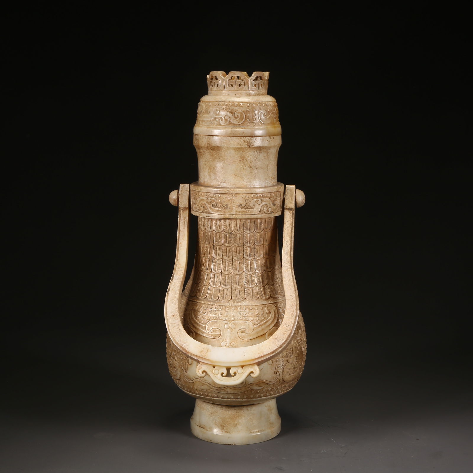 A ANCIENT JADE BEAST-FACE HANDLE YOU VESSEL: Ancient jade beast-face handle you vessel