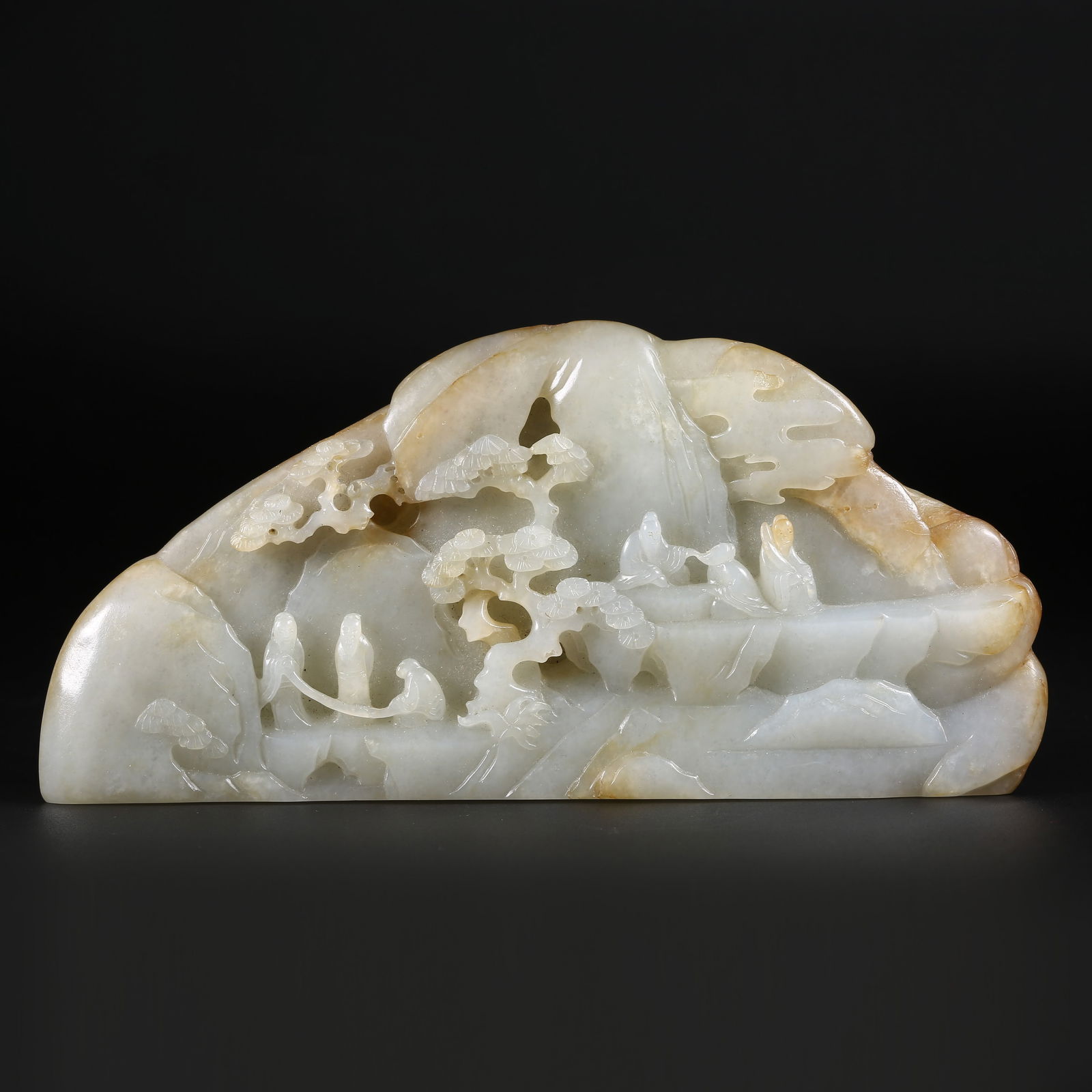 A HETIAN WHITE JADE MINIATURE MOUNTAIN WITH ELEGANT GATHERING SCENE: Hetian white jade miniature mountain with elegant gathering scene