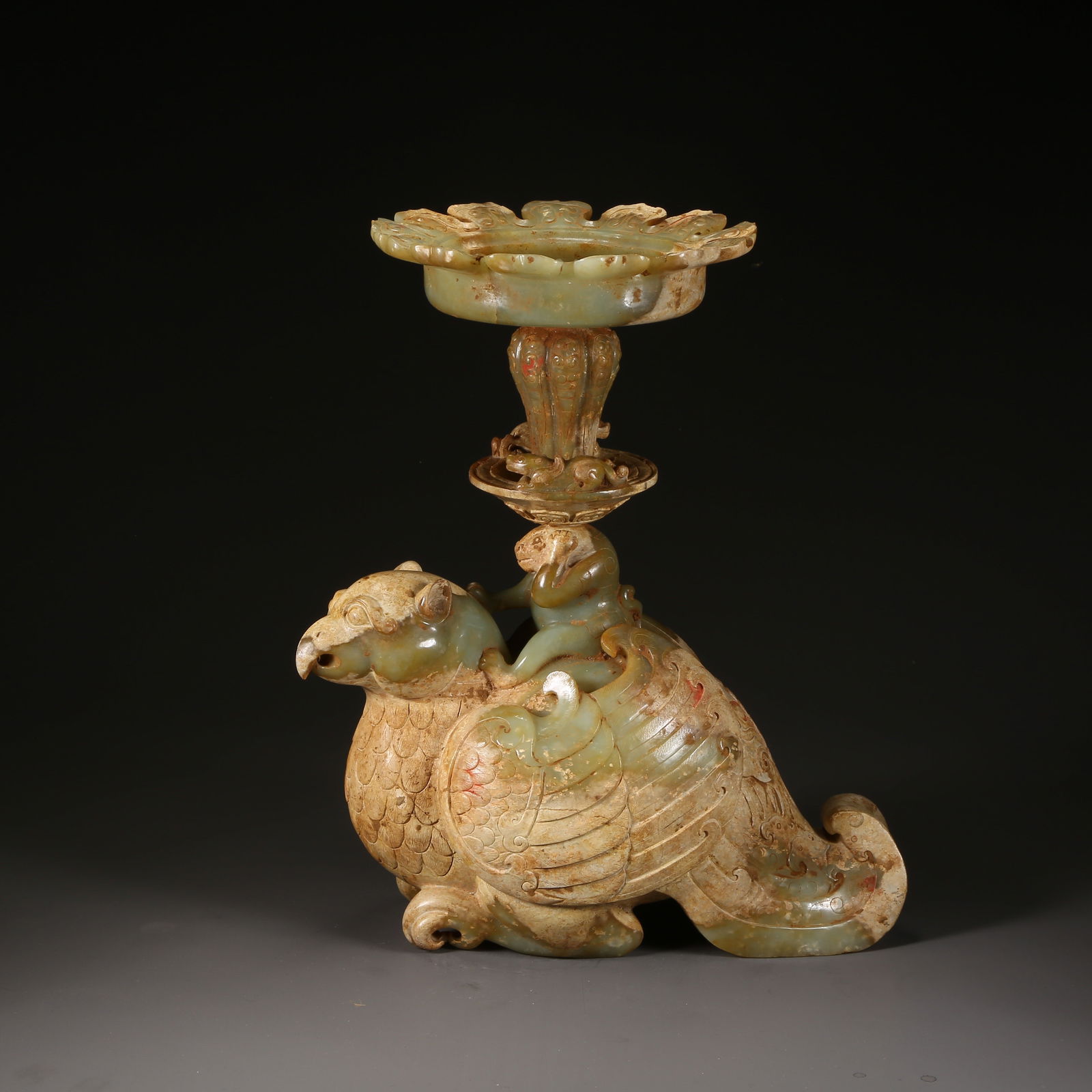 A ANCIENT JADE PHOENIX-SHAPED CANDLESTICK: Ancient jade phoenix-shaped candlestick