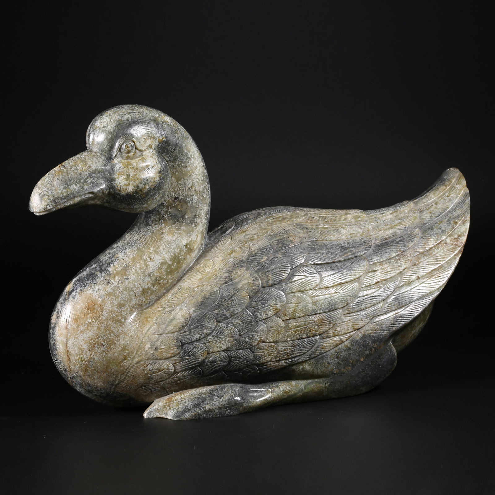 A HETIAN JADE BLUE-AND-WHITE JADEITE "PRECIOUS DUCK" FIGURINE: Hetian jade blue-and-white jadeite "Precious Duck" figurine