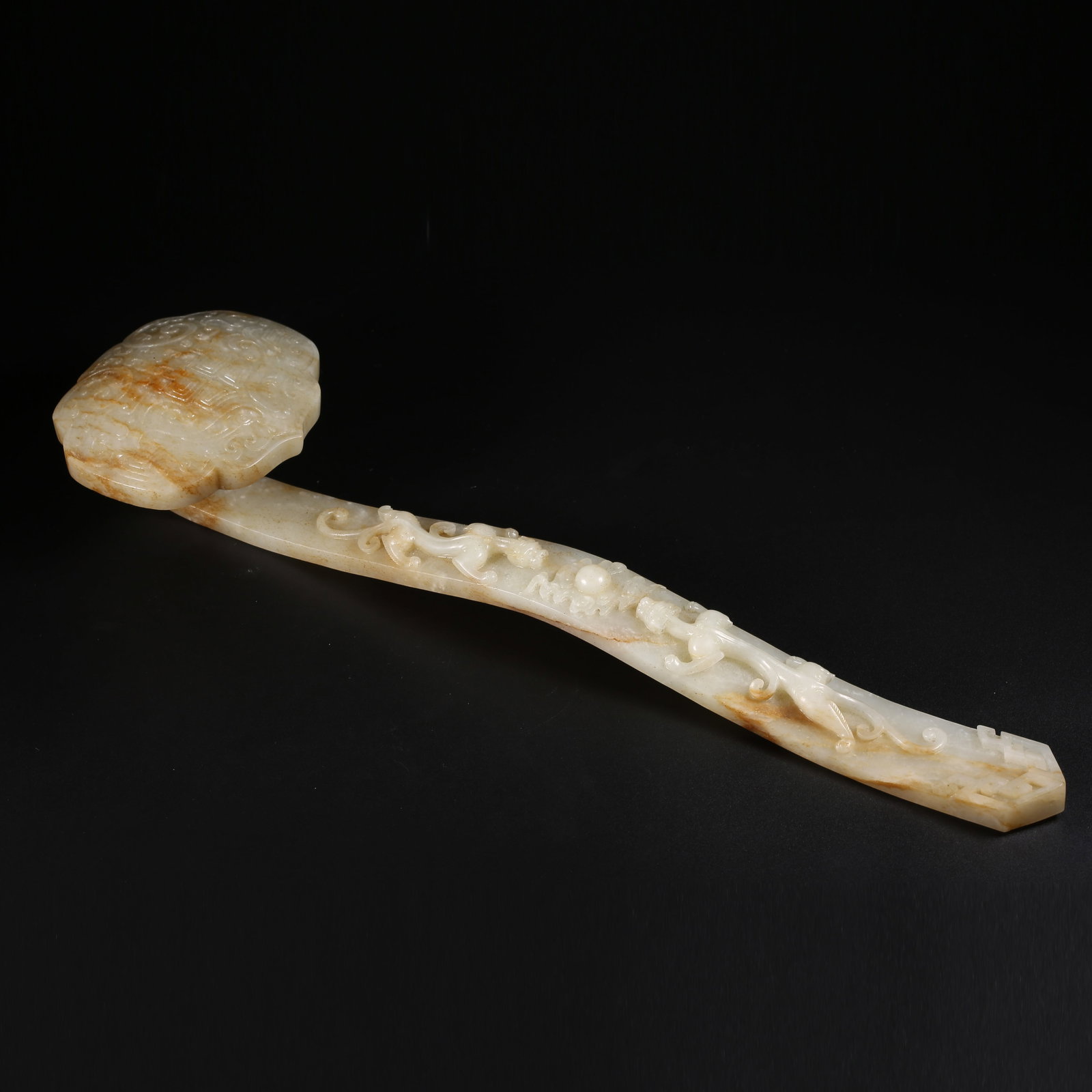 A HETIAN JADE BEAST-FACE RUYI ORNAMENT: Hetian jade beast-face ruyi ornament