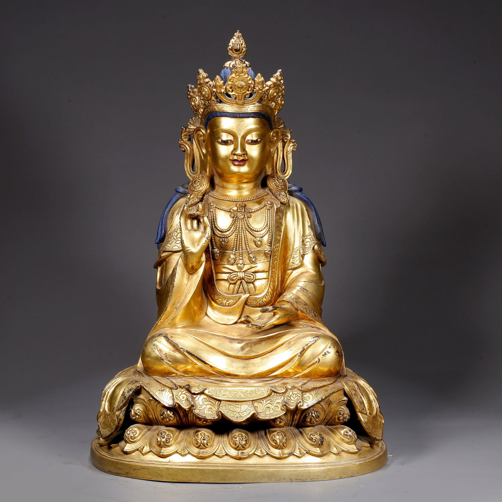 A GILT BRONZE STATUE OF CROWNED SHAKYAMUNI: Gilt Bronze Statue of Crowned Shakyamuni