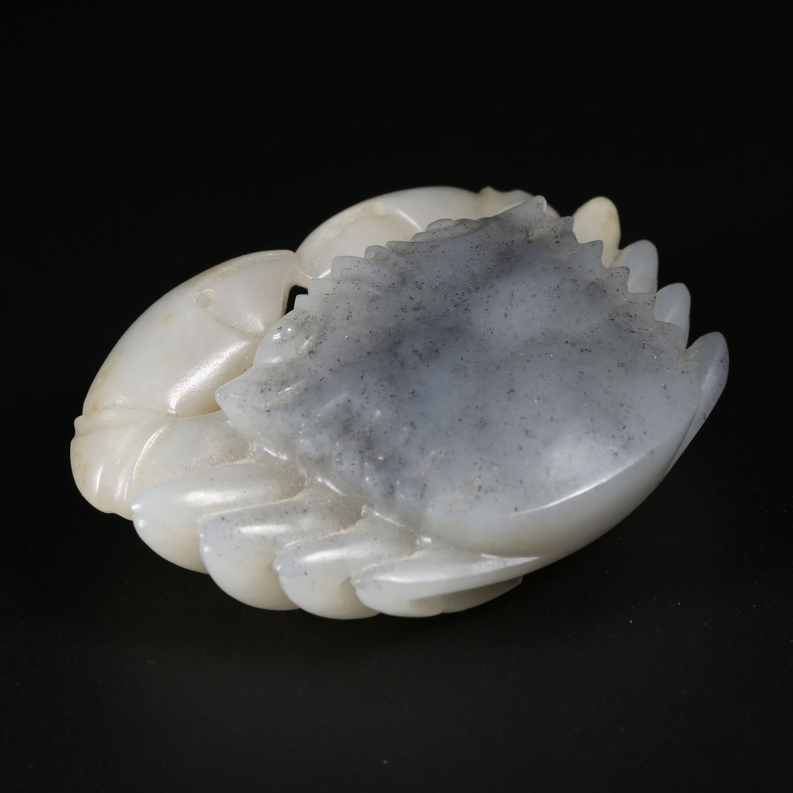 A HETIAN JADE FINELY CARVED "WEALTHY MAGNATE" FIGURINE: Hetian jade finely carved "Wealthy Magnate" figurine