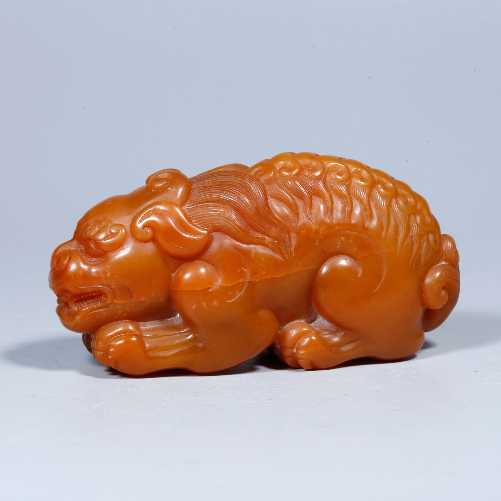 A SHOUSHAN TIANHUANG STONE ORNAMENT CARVED IN THE FORM OF A LION (1 of 9)