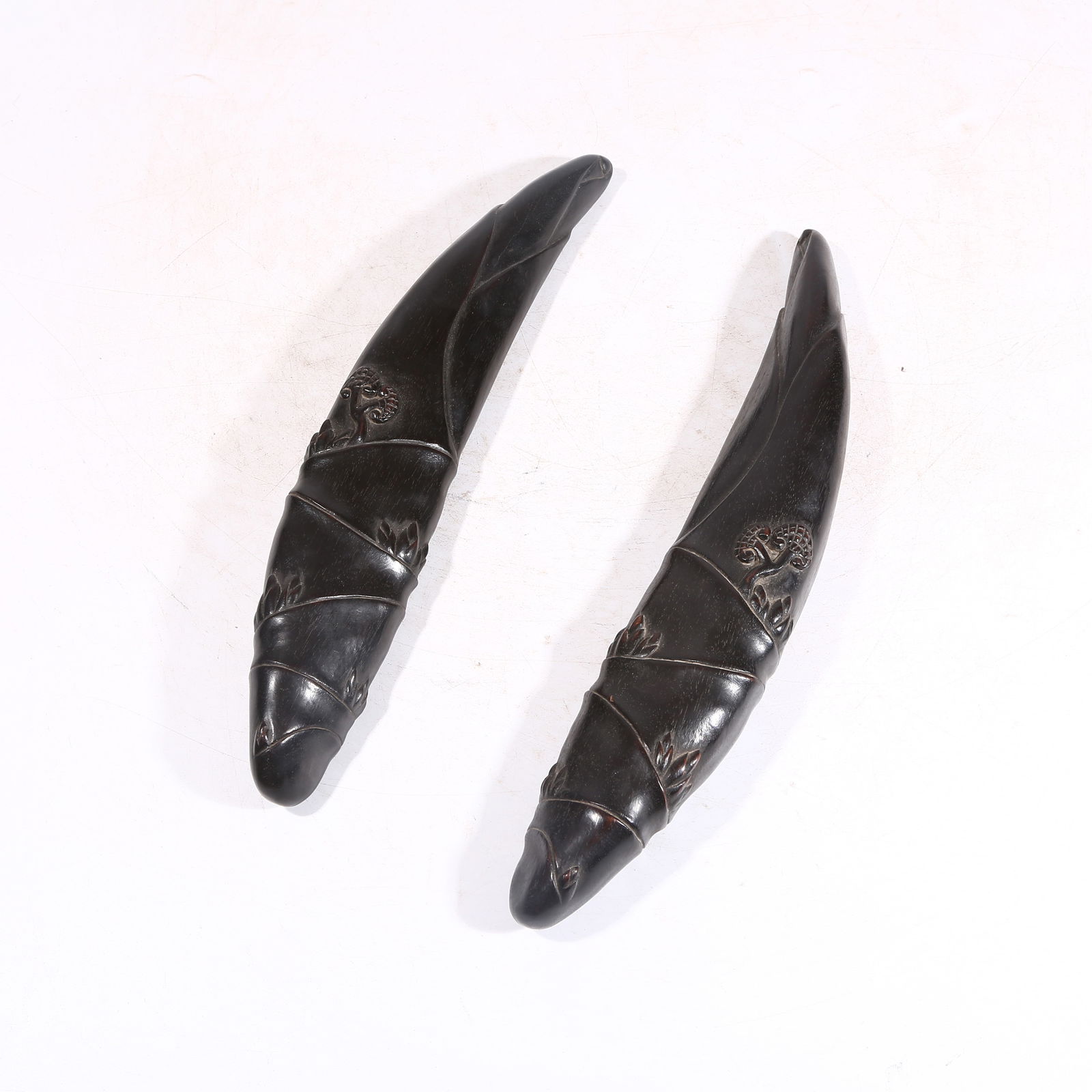 A ZITAN WOOD PAPERWEIGHT SHAPED LIKE BAMBOO SHOOT: Zitan Wood Paperweight Shaped like Bamboo Shoot