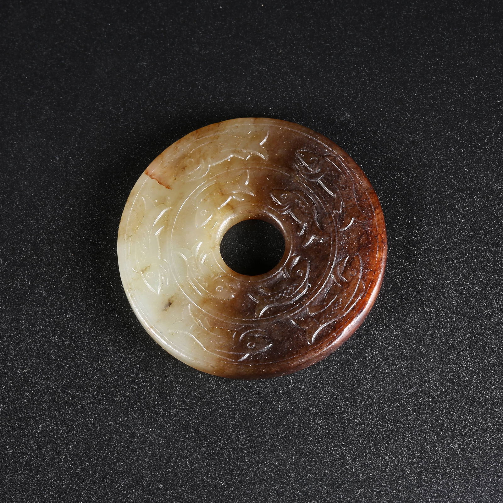 A HETIAN JADE BI-DISC WITH FISH PATTERN (1 of 10)
