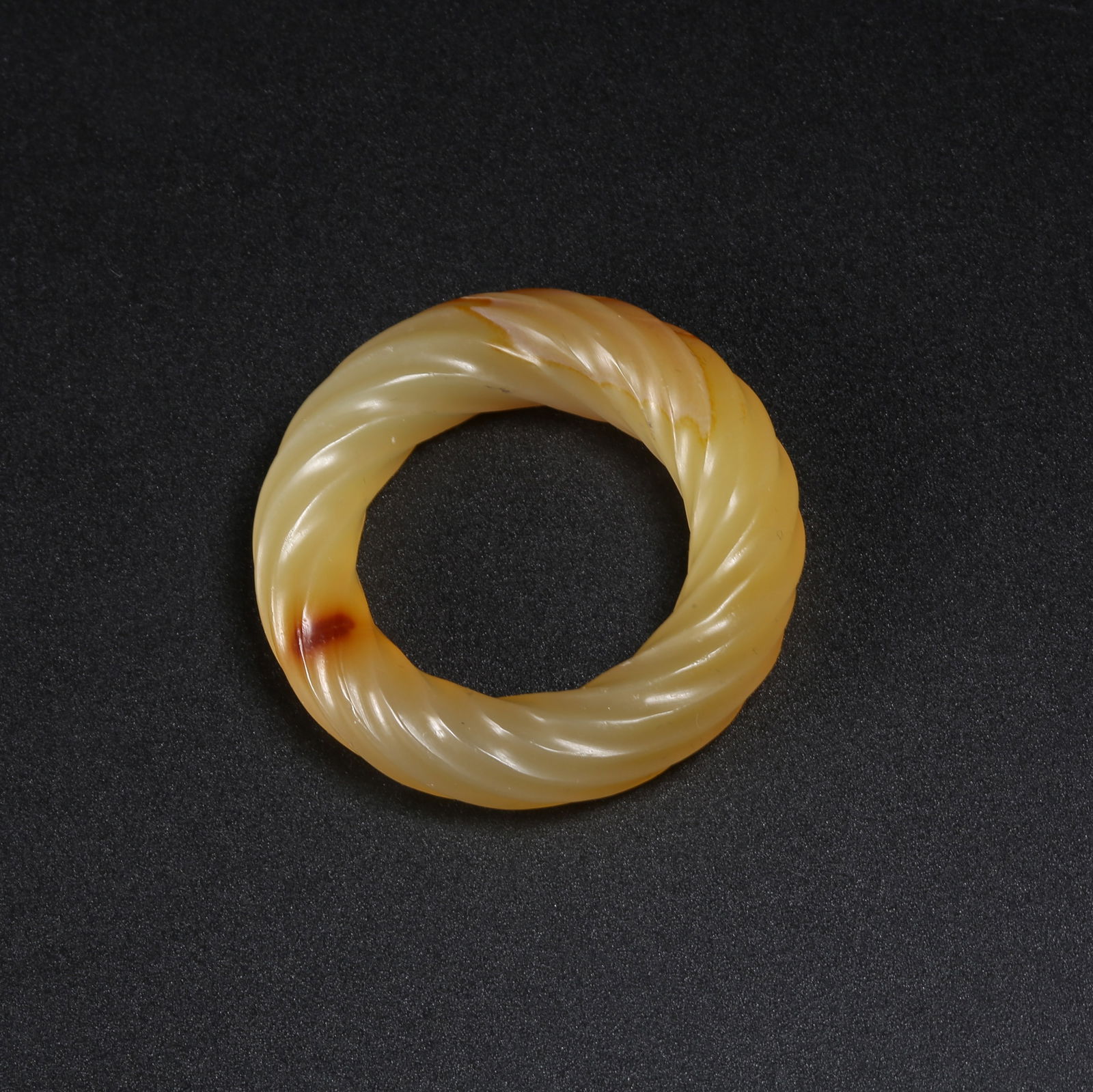 A ARCHAIC JADE TWISTED-WIRE RING (1 of 9)