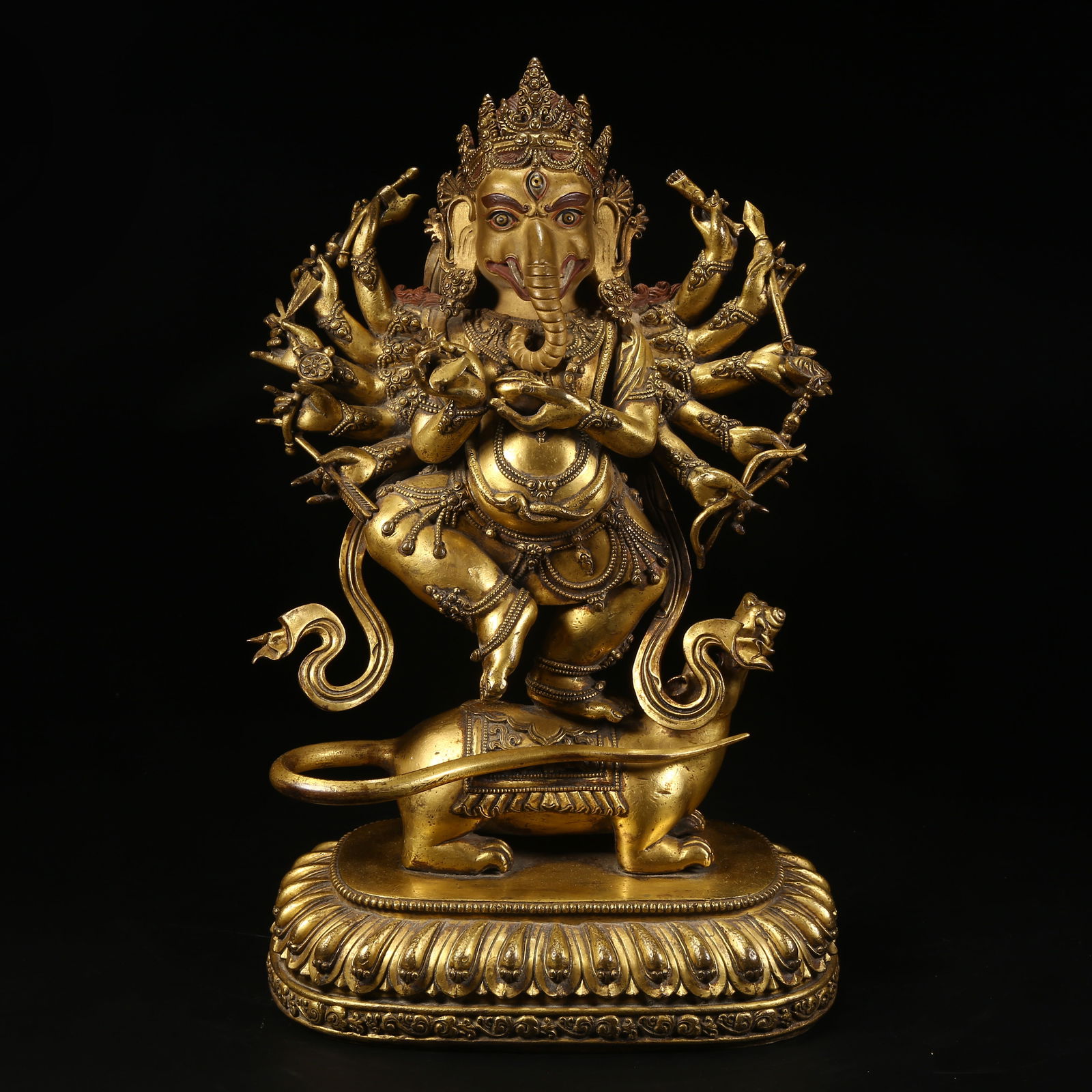 A GILT BRONZE STATUE OF ELEPHANT-TRUNKED WEALTH DEITY (1 of 8)