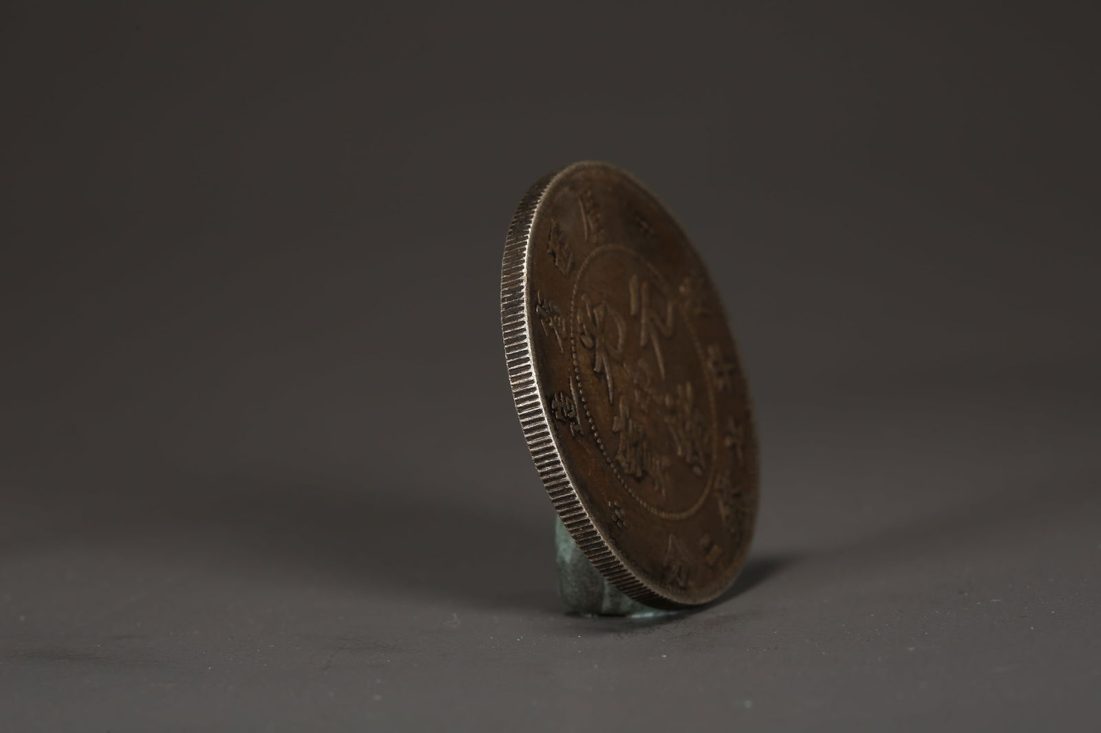 A SILVER DOLLAR COIN - 2