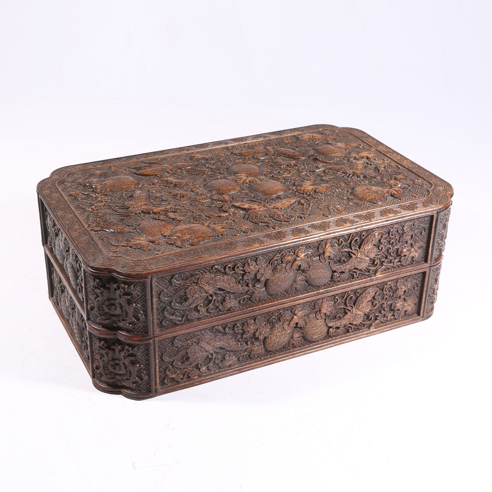 A HUANGHUALI WOOD SQUARE CORNERED COVERED BOX WITH AUSPICIOUS FRUIT AND BUTTERFLY MOTIF: Huanghuali Wood Square Cornered Covered Box with Auspicious Fruit and Butterfly Motif