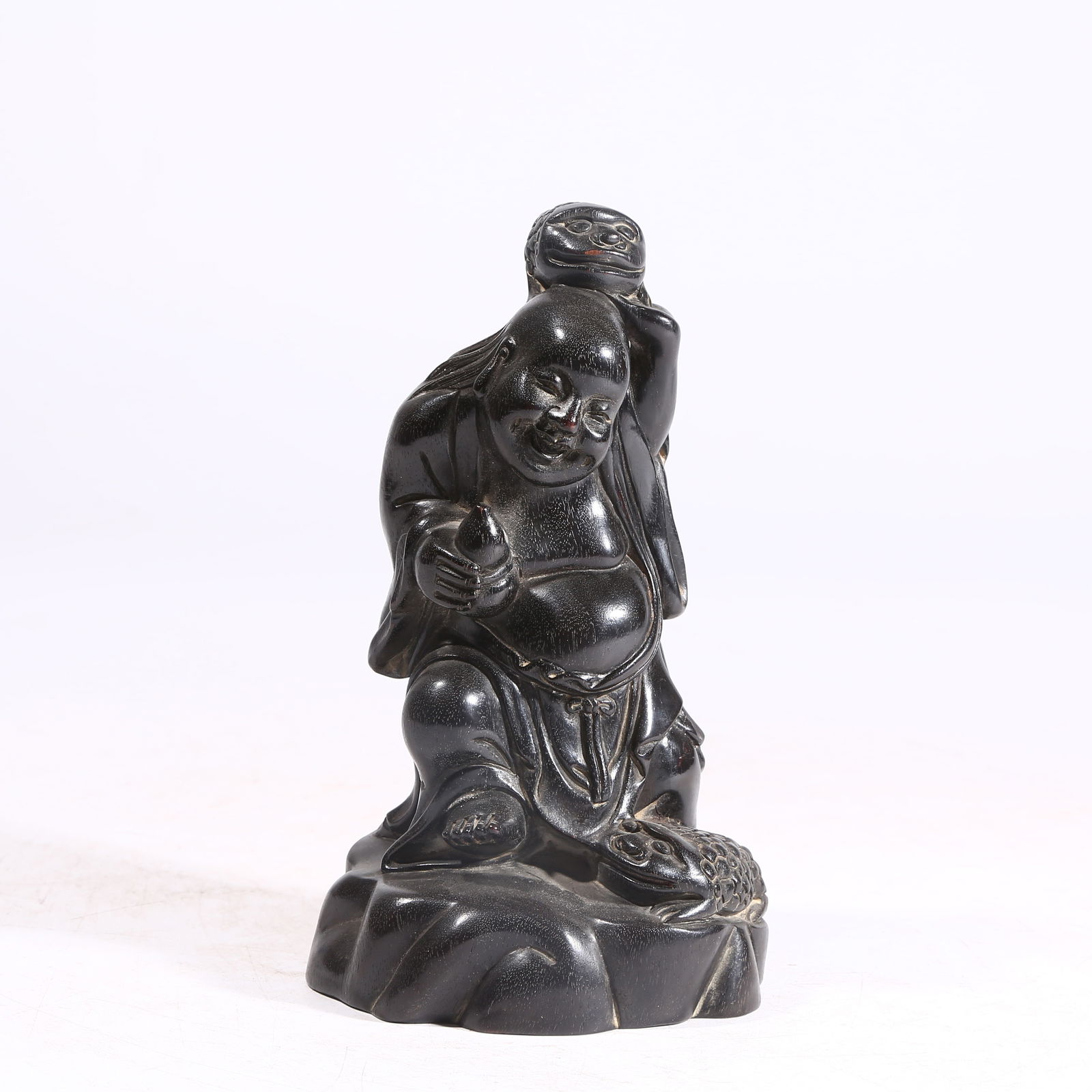 A ZITAN WOOD ORNAMENT OF LIU HAI PLAYING WITH A GOLDEN TOAD: Zitan Wood Ornament of Liu Hai Playing with a Golden Toad