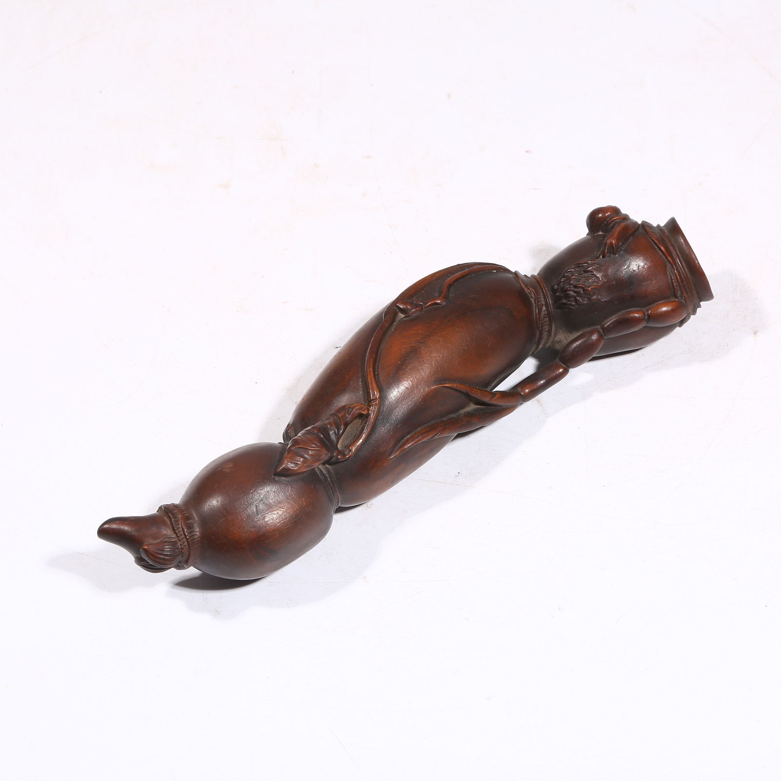 A HUANGHUALI WOOD LOTUS ROOT SHAPED RUYI: Huanghuali Wood Lotus Root Shaped Ruyi