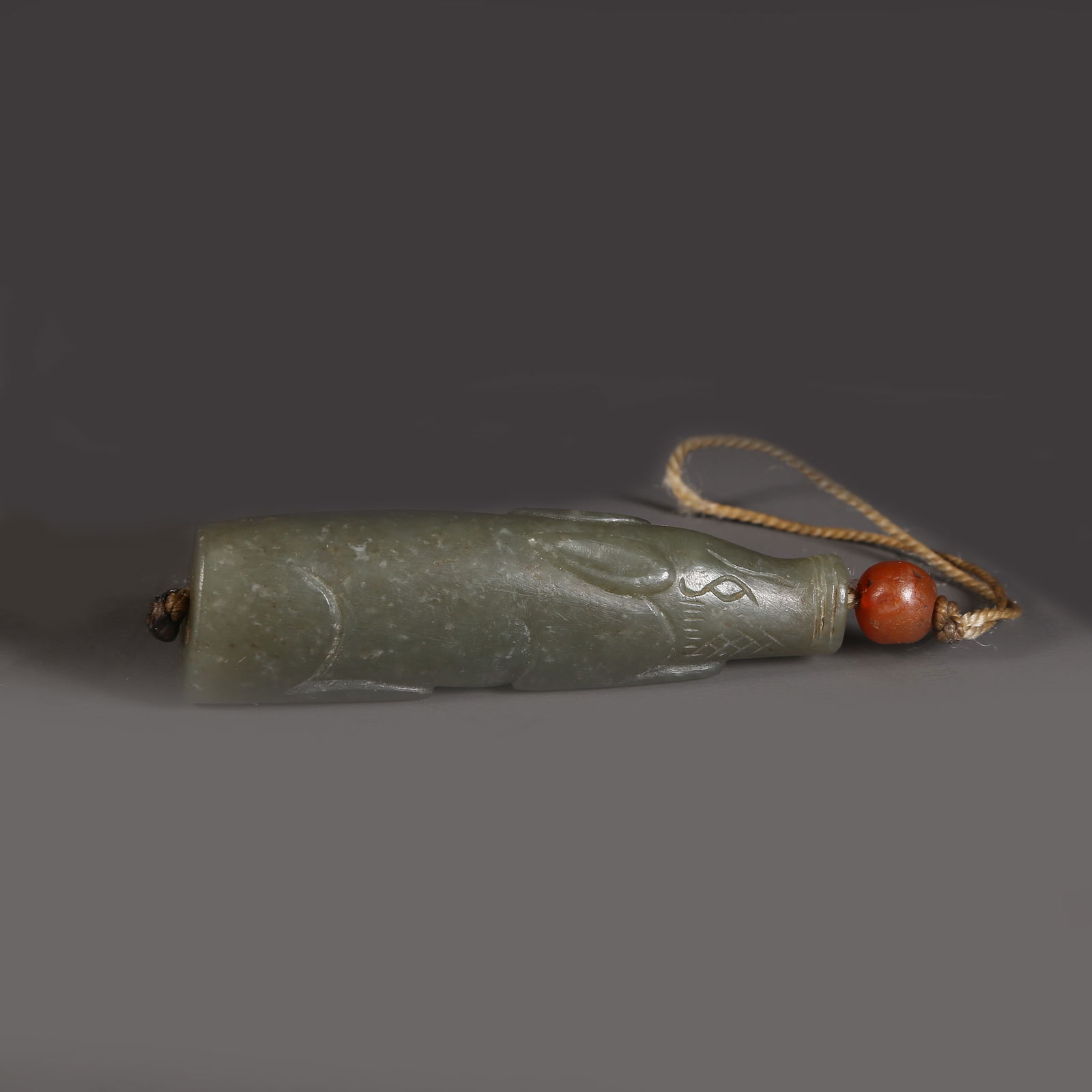 A ARCHAIC JADE HAND-HELD OBJECT (1 of 9)