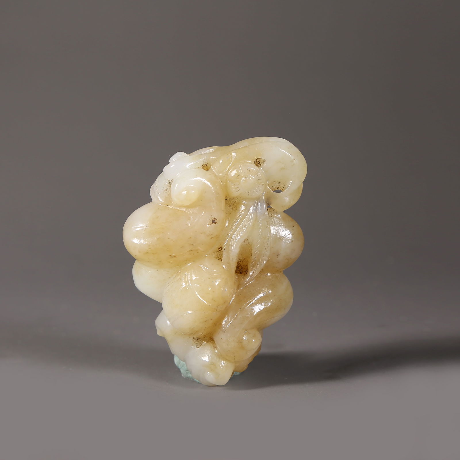 A HETIAN JADE AUSPICIOUS FRUIT PENDANT (1 of 6)
