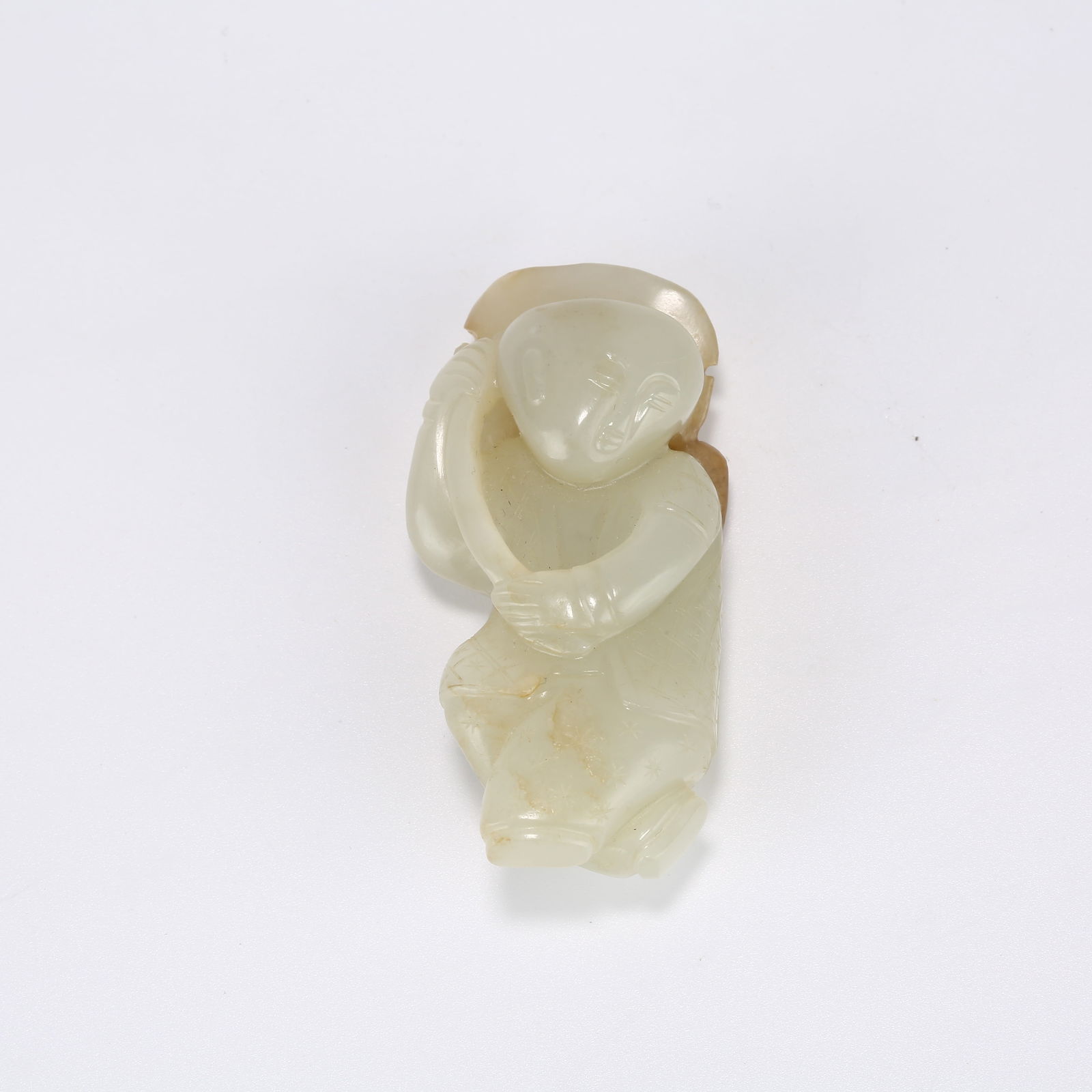 A HETIAN JADE BOY HOLDING LOTUS: Hetian Jade Boy Holding Lotus