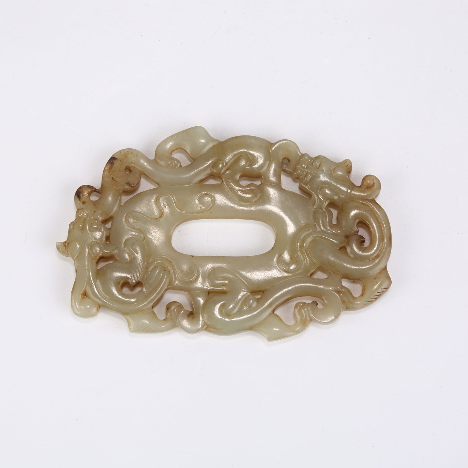 A ANCIENT JADE CHICKEN-HEART PENDANT WITH CHI DRAGON PATTERN (1 of 5)