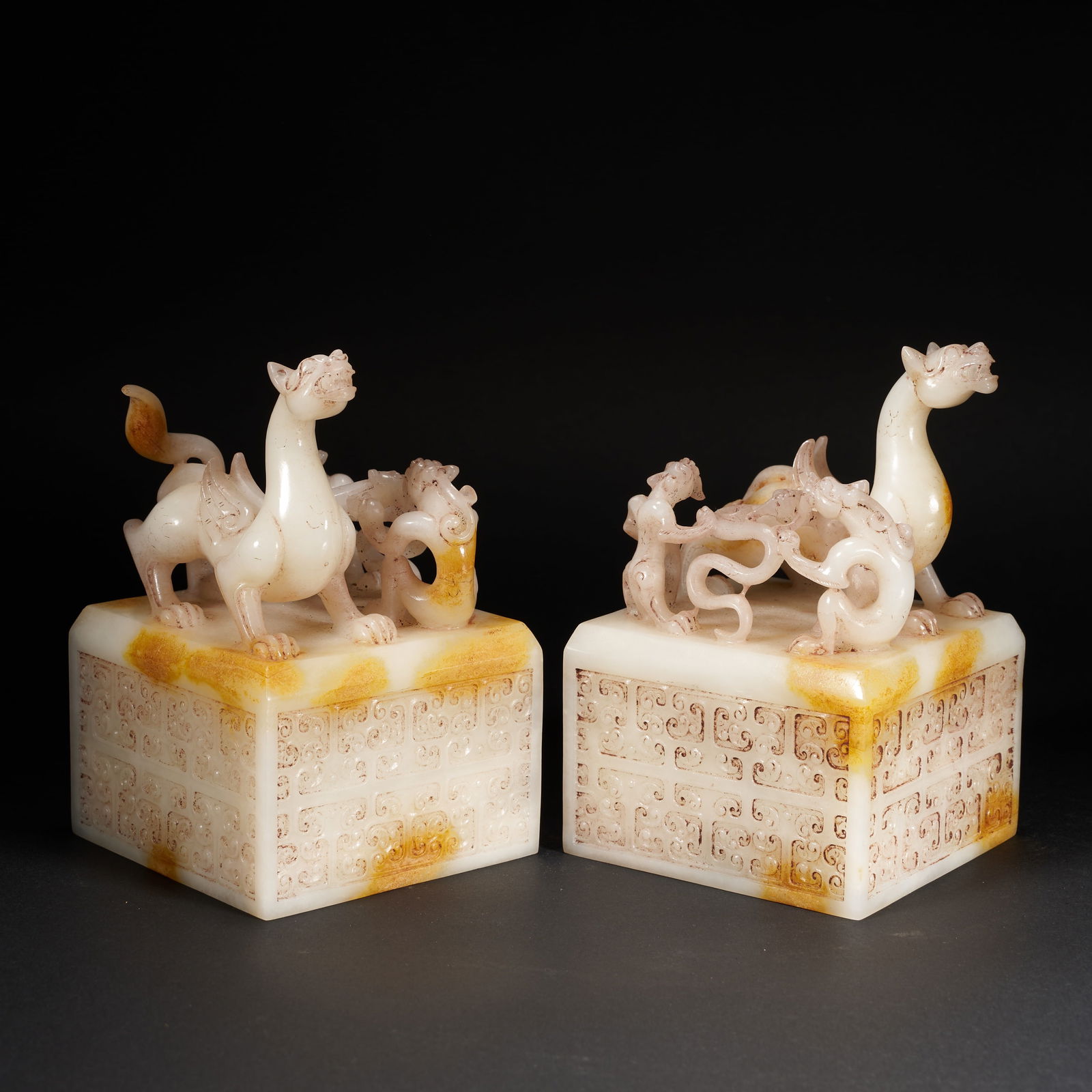 A A GROUP OF HETIAN JADE SEALS WITH DRAGON FINIALS, HAN DYNASTY (1 of 7)