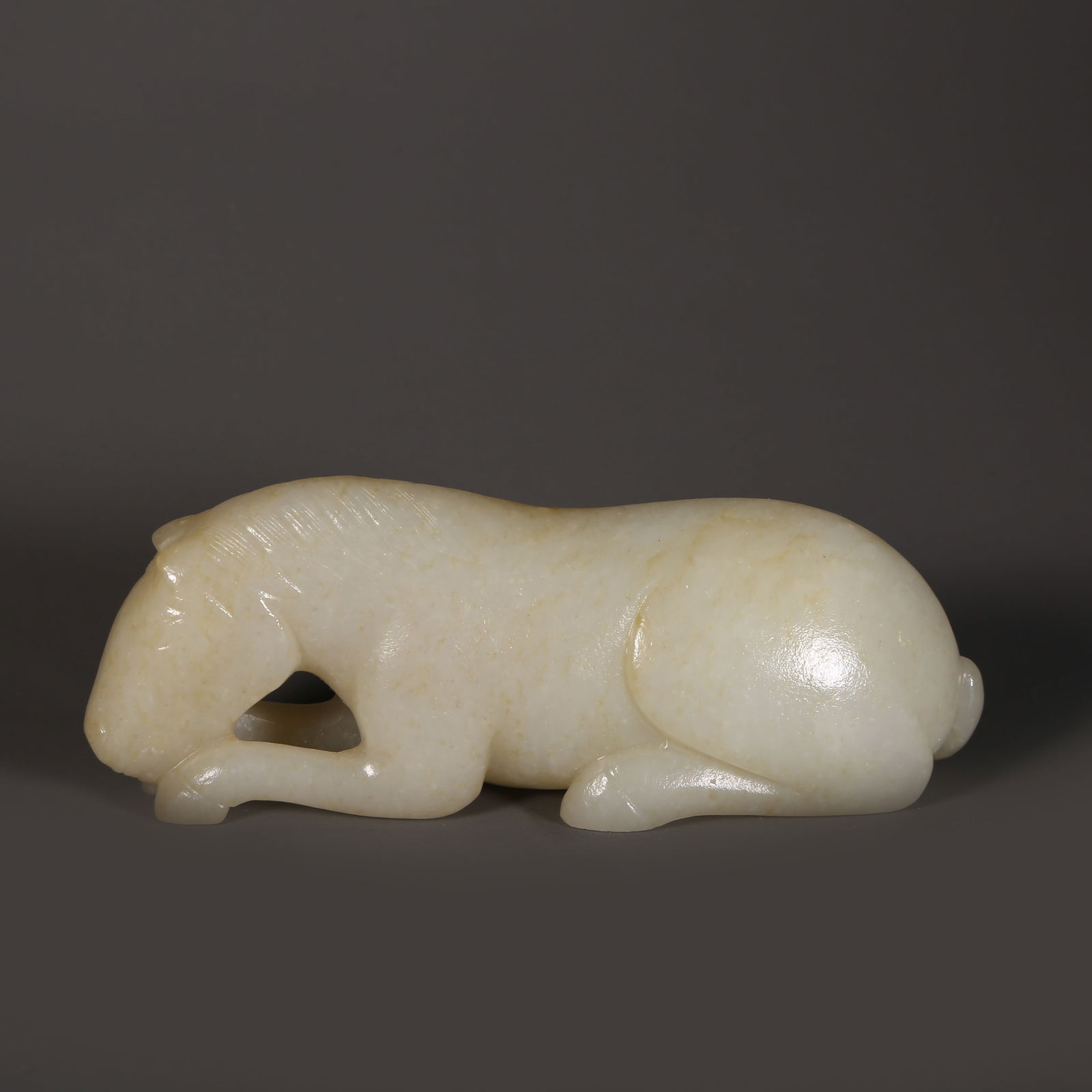 A HETIAN JADE RECUMBENT HORSE ORNAMENT (1 of 8)