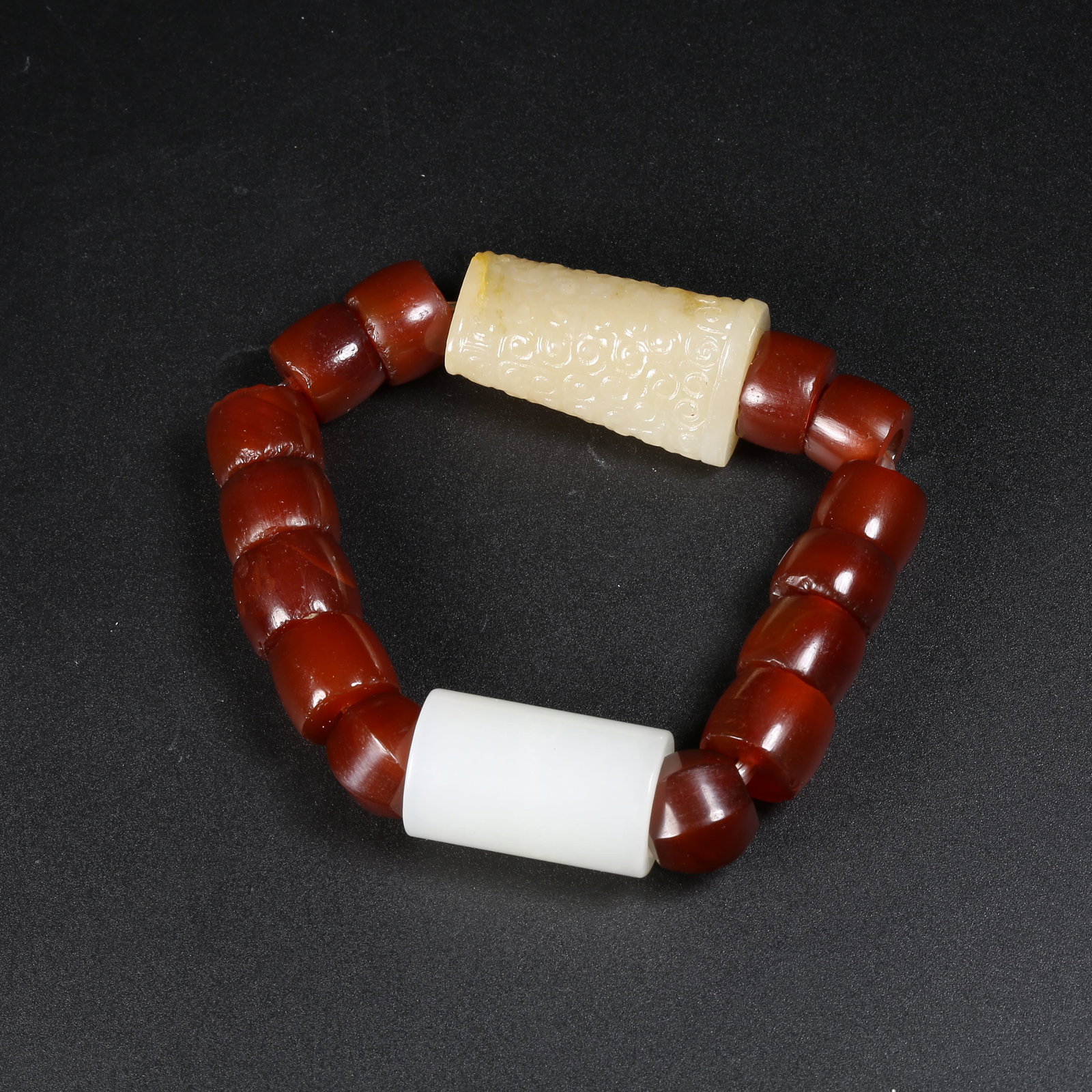 A HETIAN JADE LEZI HAND-STRUNG BRACELET (1 of 7)