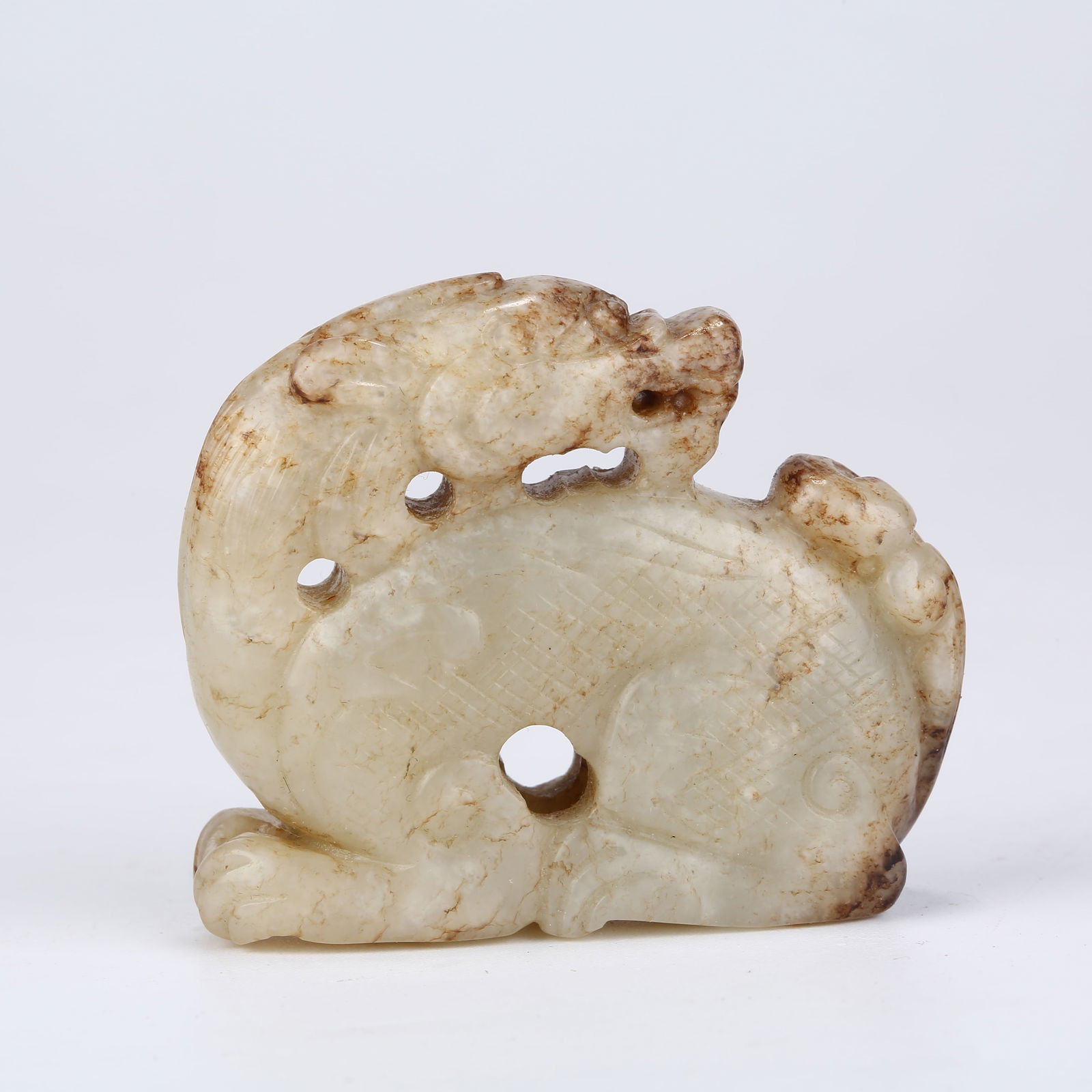 A HETIAN JADE AUSPICIOUS BEAST ORNAMENT (1 of 8)
