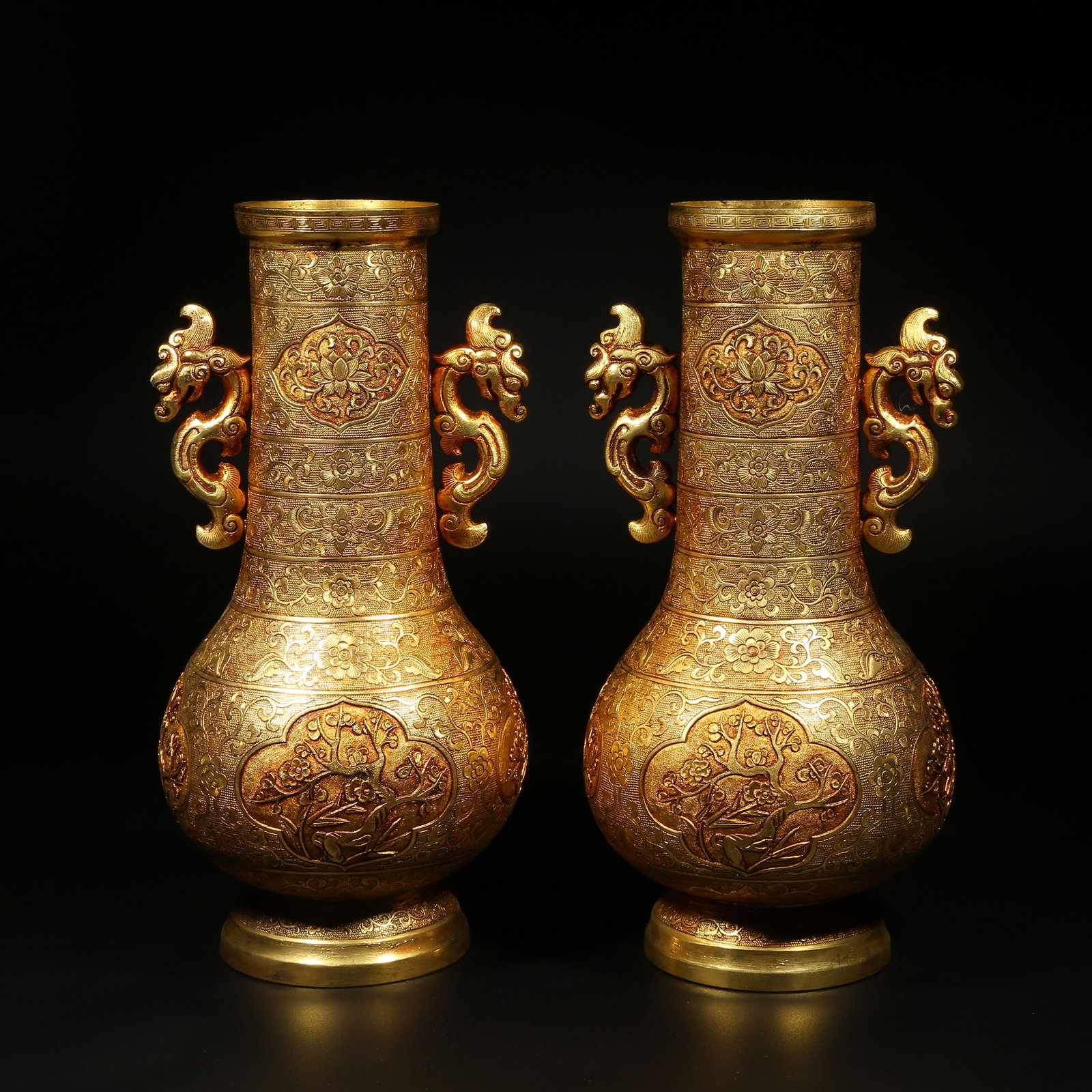 A GILDED BRONZE PLUM BLOSSOM PATTERN VASES WITH DRAGON HANDLES, PAIR (1 of 10)