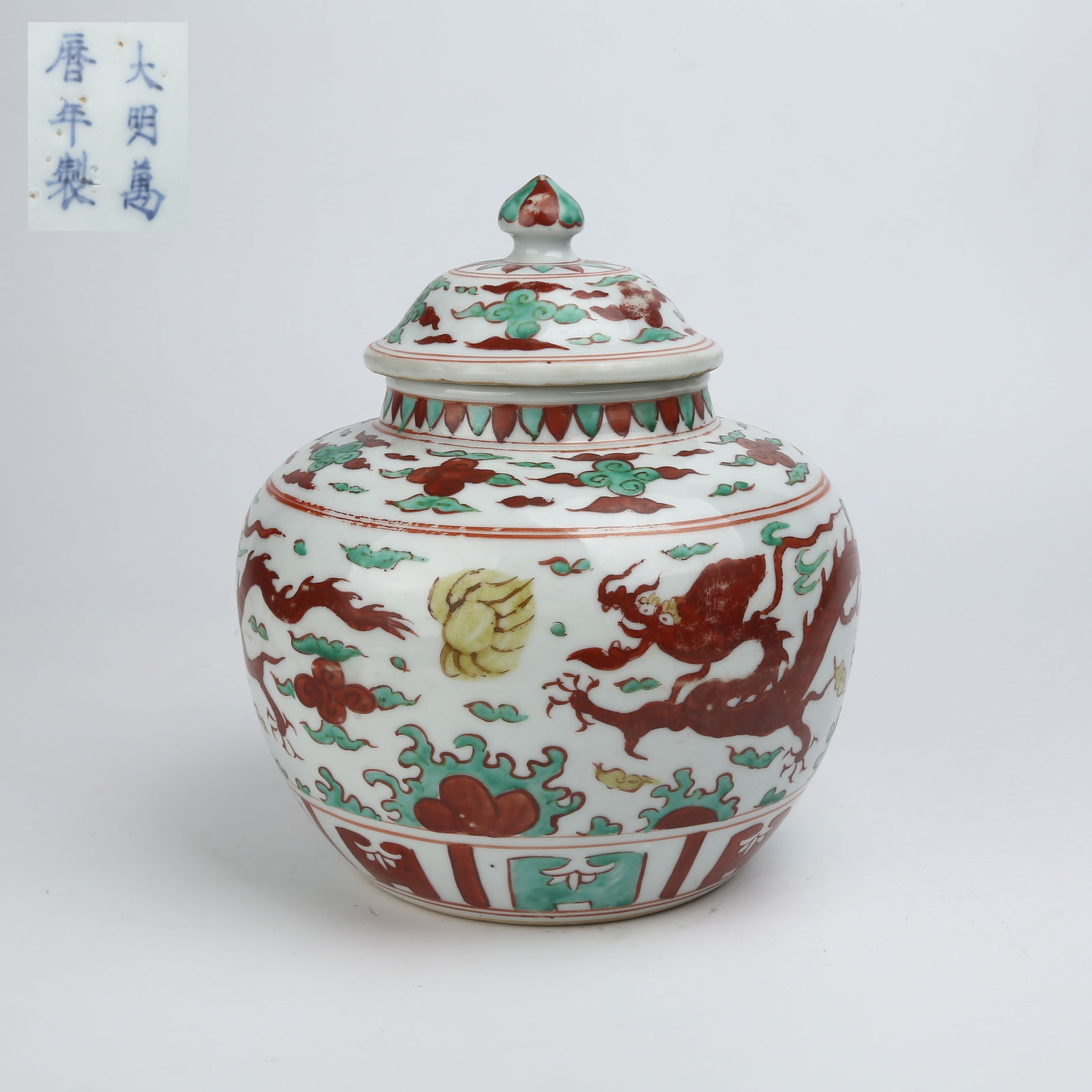 A RED AND GREEN ENAMEL COVERED JAR WITH CLOUD AND DRAGON CHASING PEARL PATTERN (1 of 9)